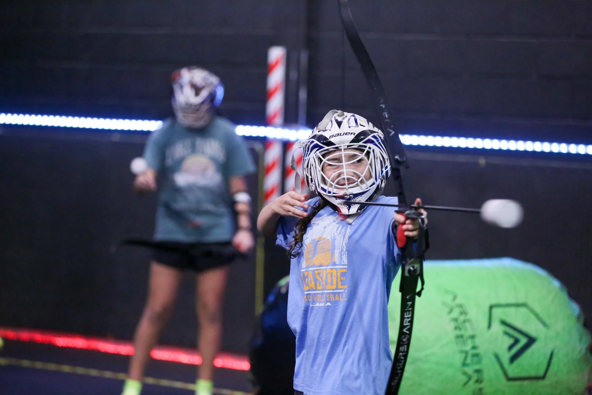 Teenagers playing Combat Archery at Archers Arena in Toronto