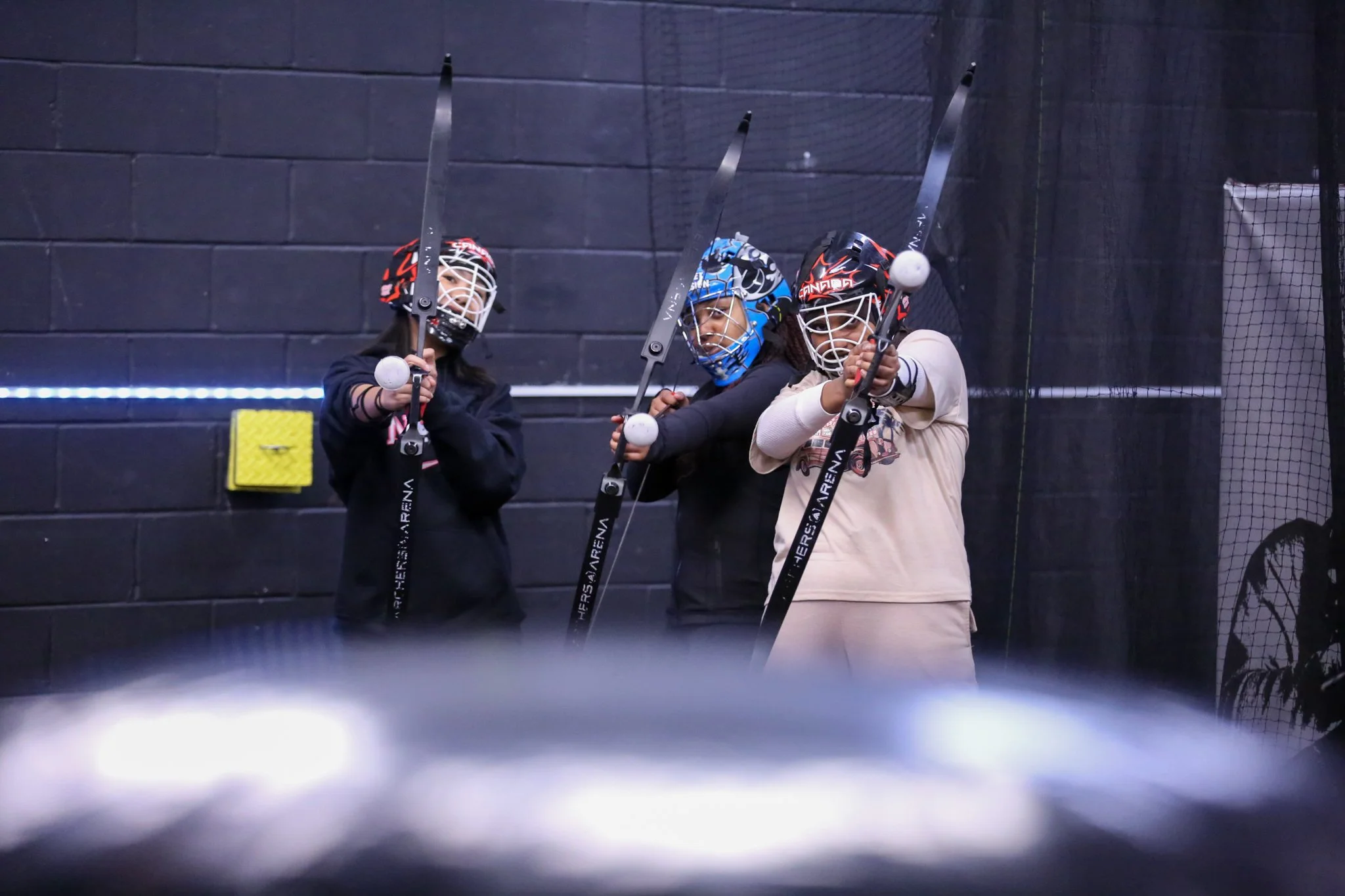 Teenagers celebrating a birthday with Combat Archery at Archers Arena in Toronto.