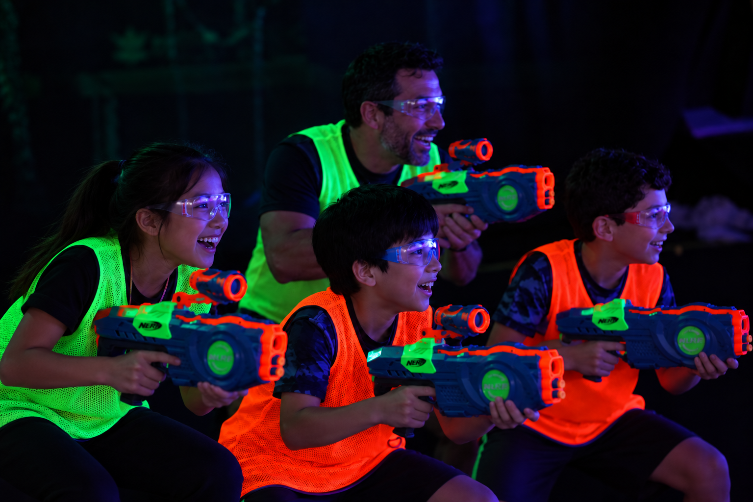 Family enjoying an indoor Nerf battle at Archers Arena Toronto