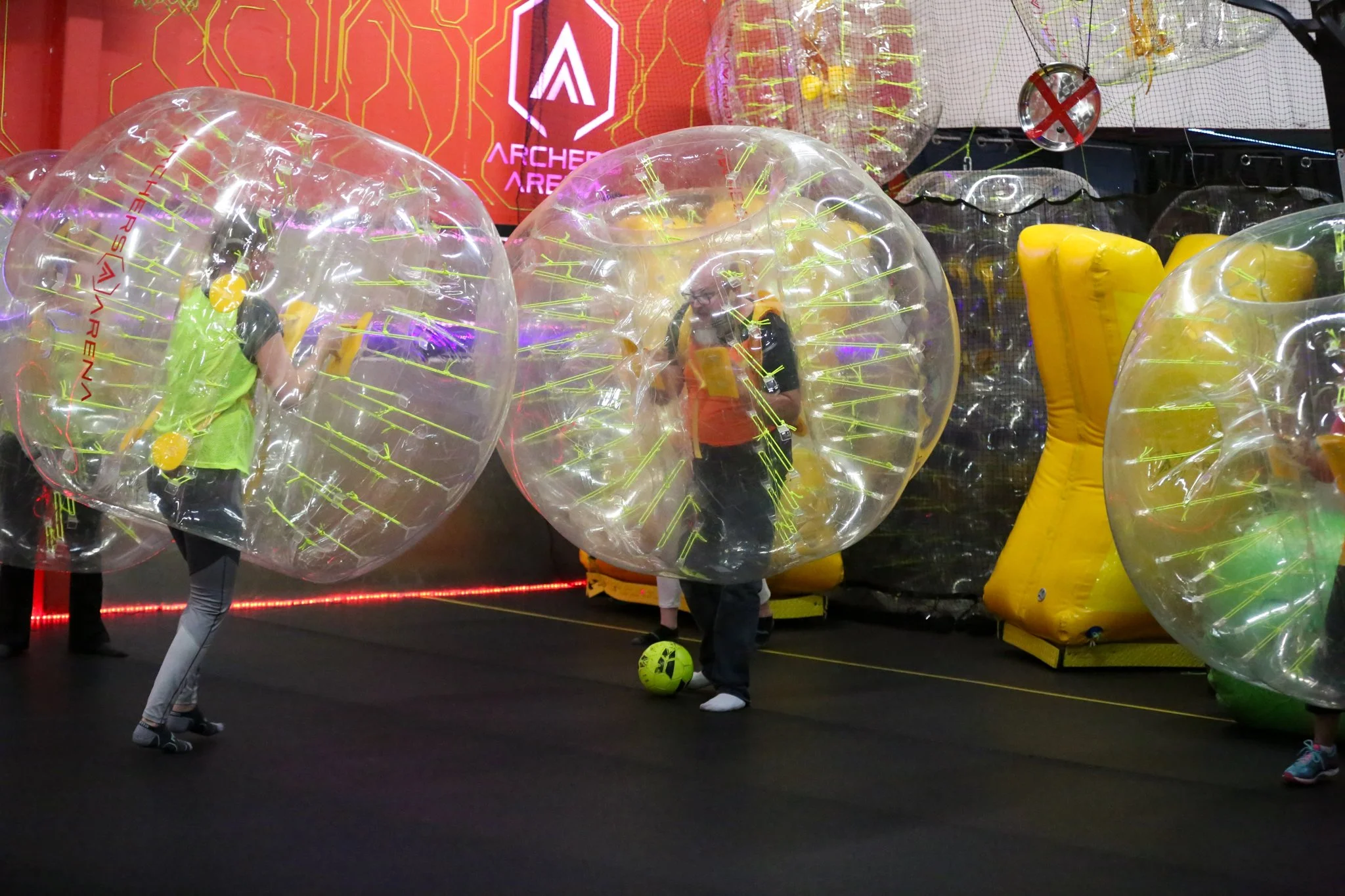 Team laughing and playing bubble soccer during corporate event in Toronto