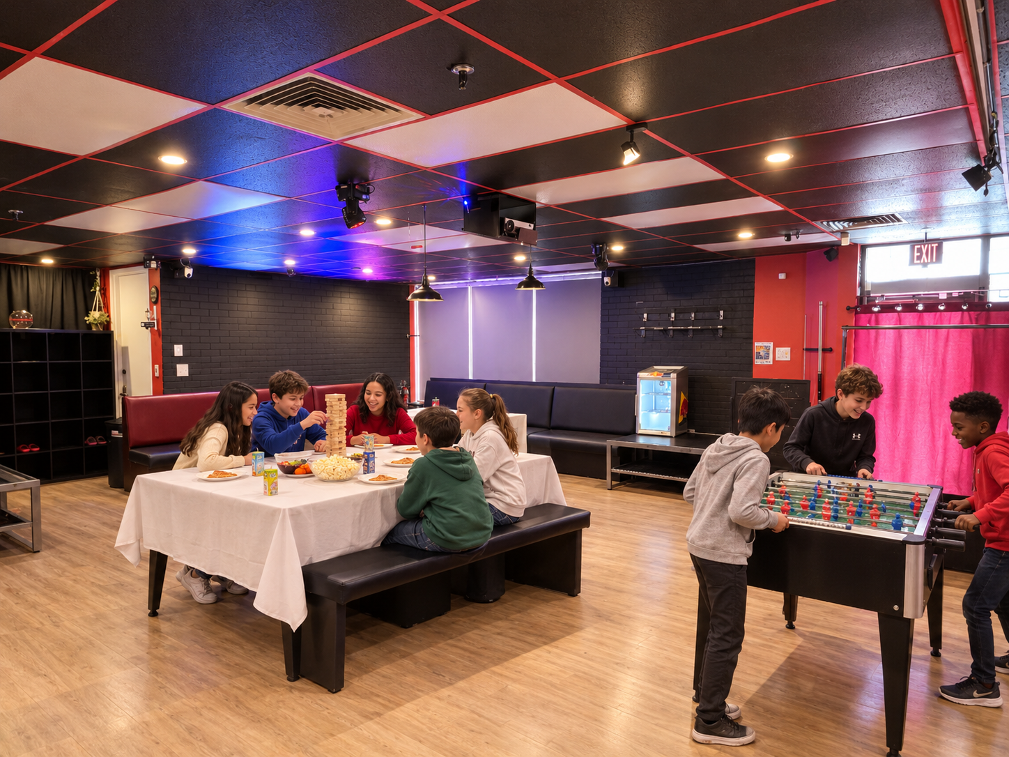 Group of kids sharing snacks in the party lounge during a PA day at Archers Arena