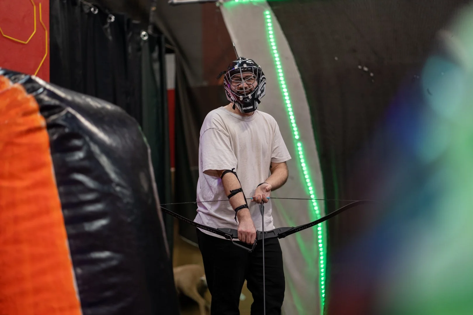 Corporate team playing combat archery at Archers Arena Toronto