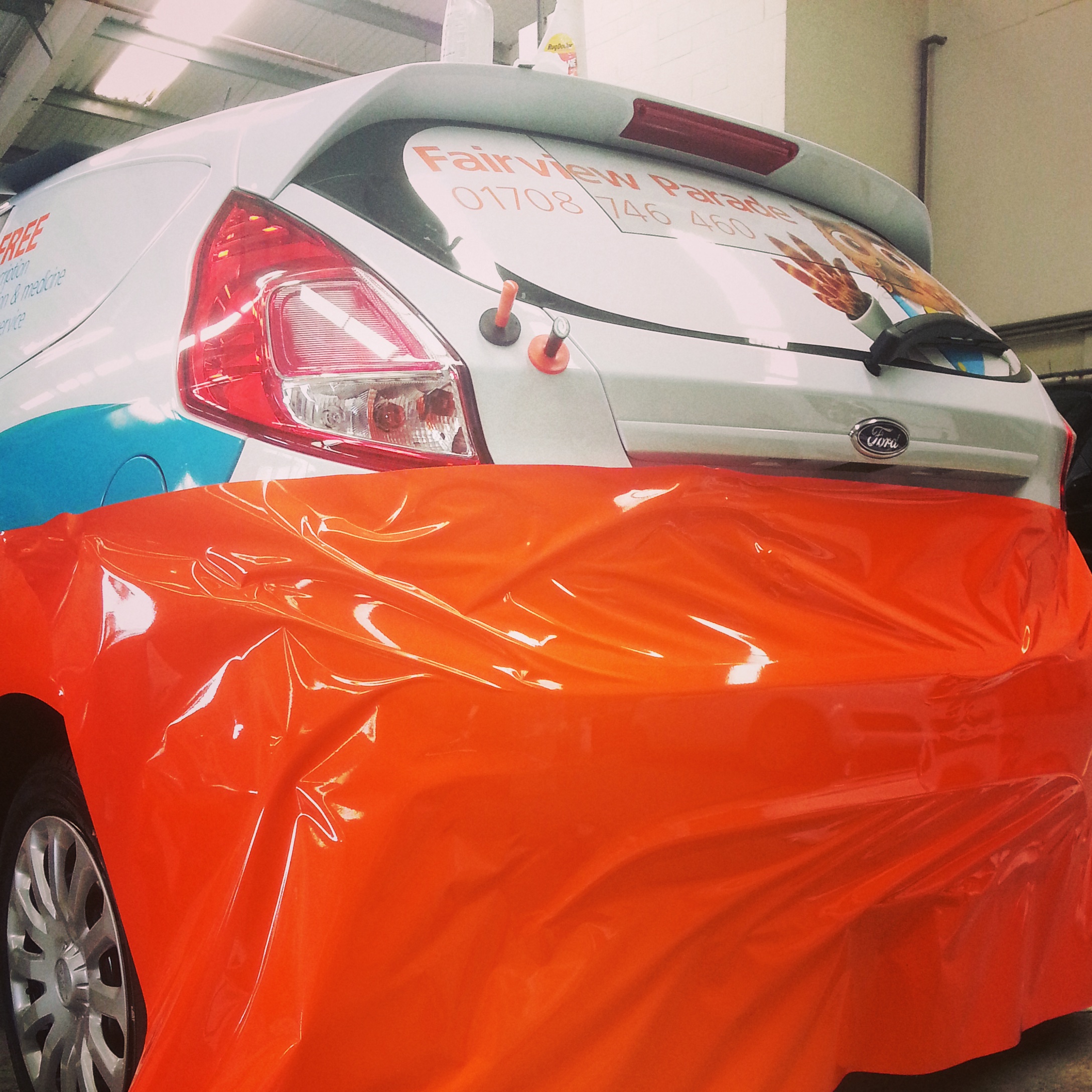 Vehicle wrap installation in progress - Hexis wrap vinyl