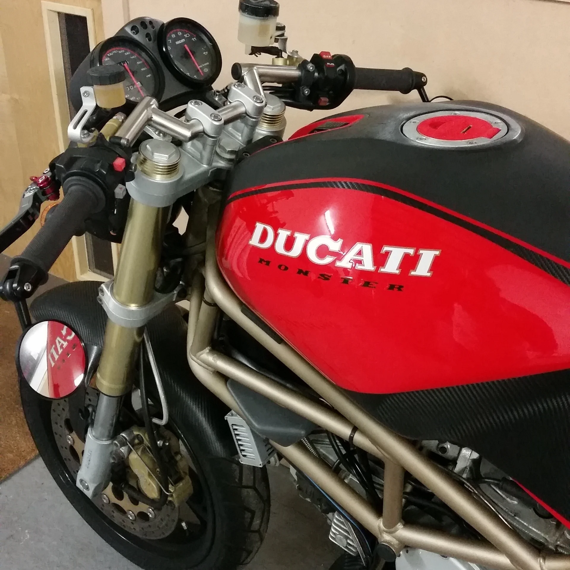 Motorcycle fuel tank wrapped in 3M carbon fibre & Matt black