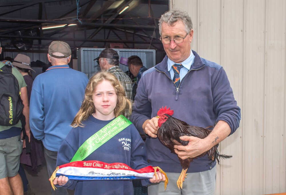  Winner of Best and Reserve Junior Birds donated by Michael and Kathy Holmes, Caitlin Mannix with her ribbons and Judge Geoff Lewis 