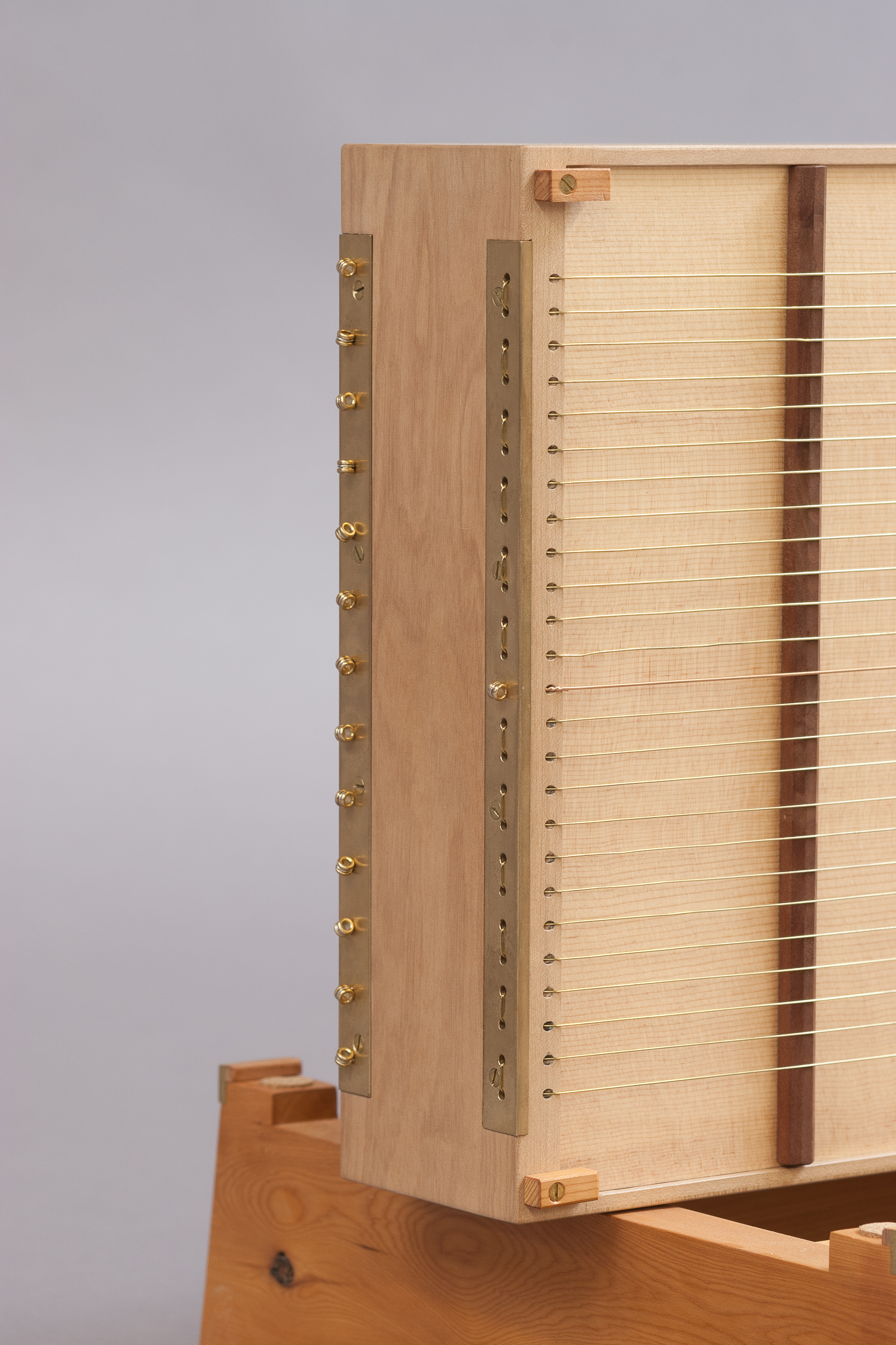 All the brass hardware is shop made, preventing wear and tear on the wood.