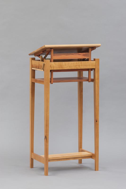 From the back. The movement is continuous, and can be locked into any position between those shown.