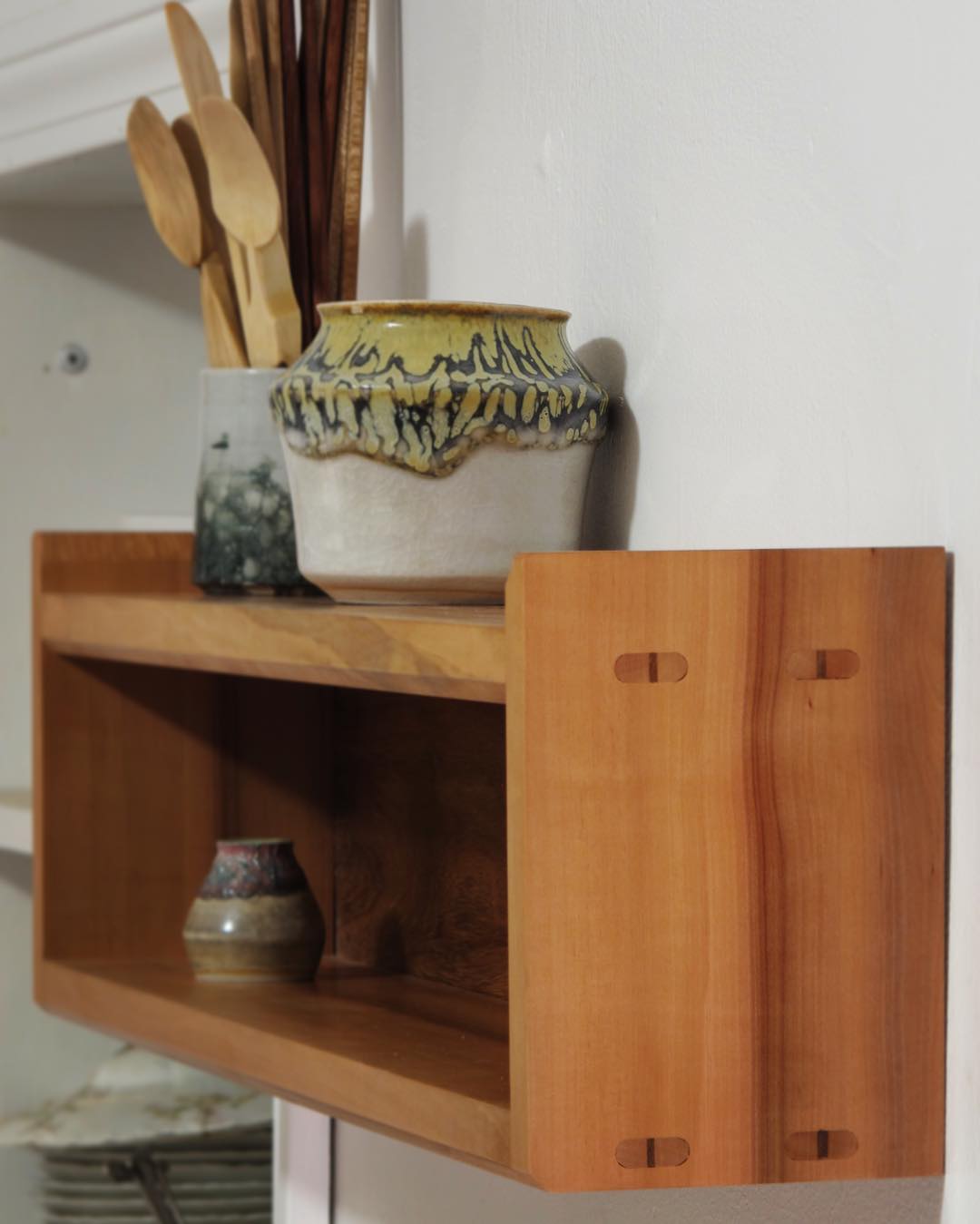 A small madrone shelf/cabinet, built with wedged through tenons, to hold my ceramics. It is finished with shellac and wax.