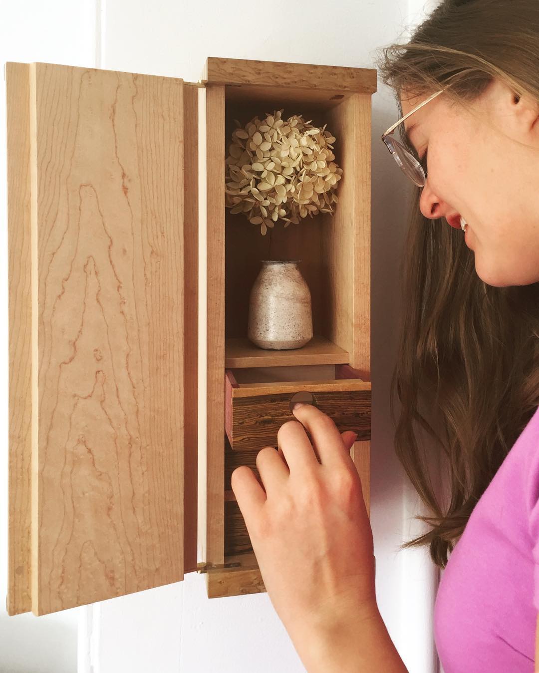 This small keepsake wall cabinet is made with dovetail joinery, cut into a beautiful board of birdseye maple, found in the racks at a local big box store.