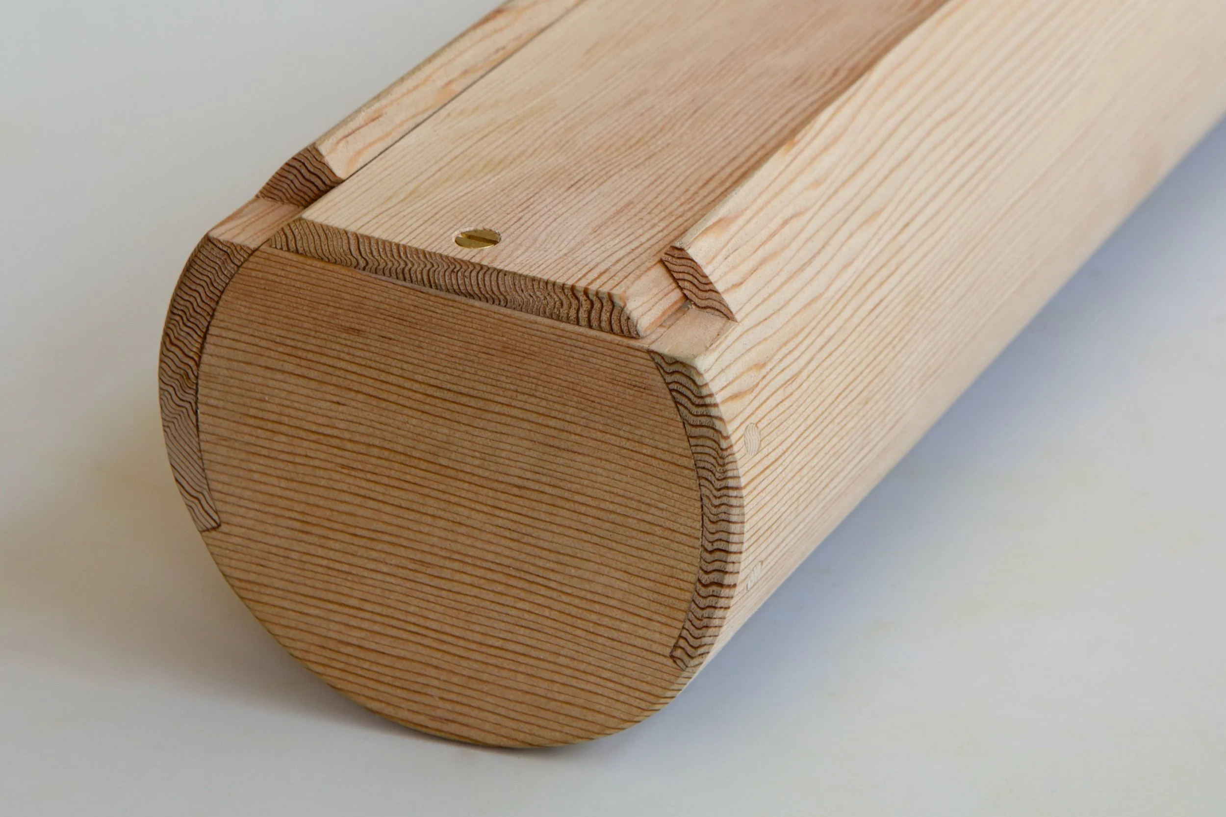  The drawer is a pretty novel construction, with single-piece coopered sides pegged to carefully rounded front and back mortises.  