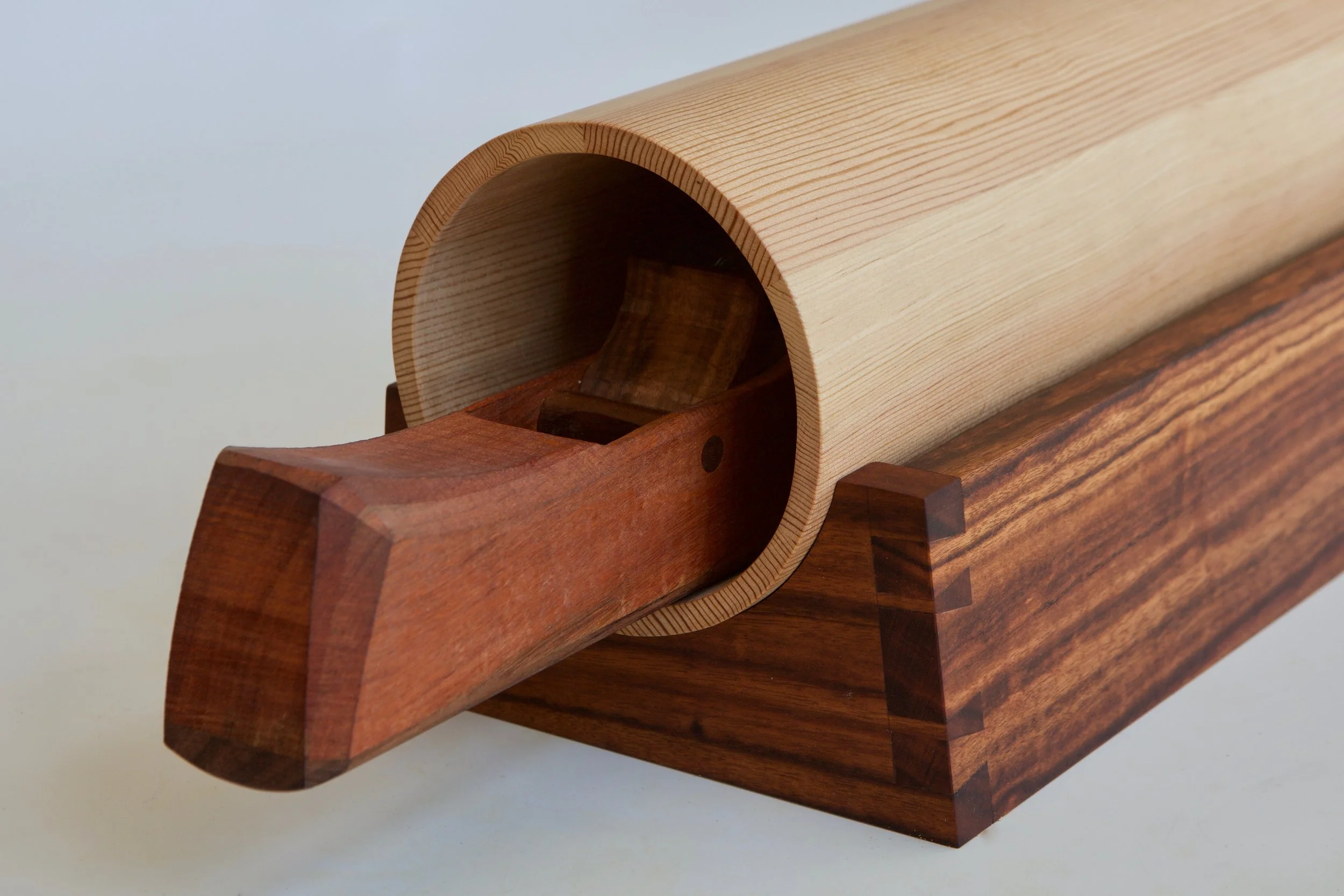  The coopering plane I made as a part of this process is shown here inside the cabinet. It works at just slightly under a 2” radius. The plane is pernambuco with a pao ferro sole, made in the laminated style of James Krenov. 