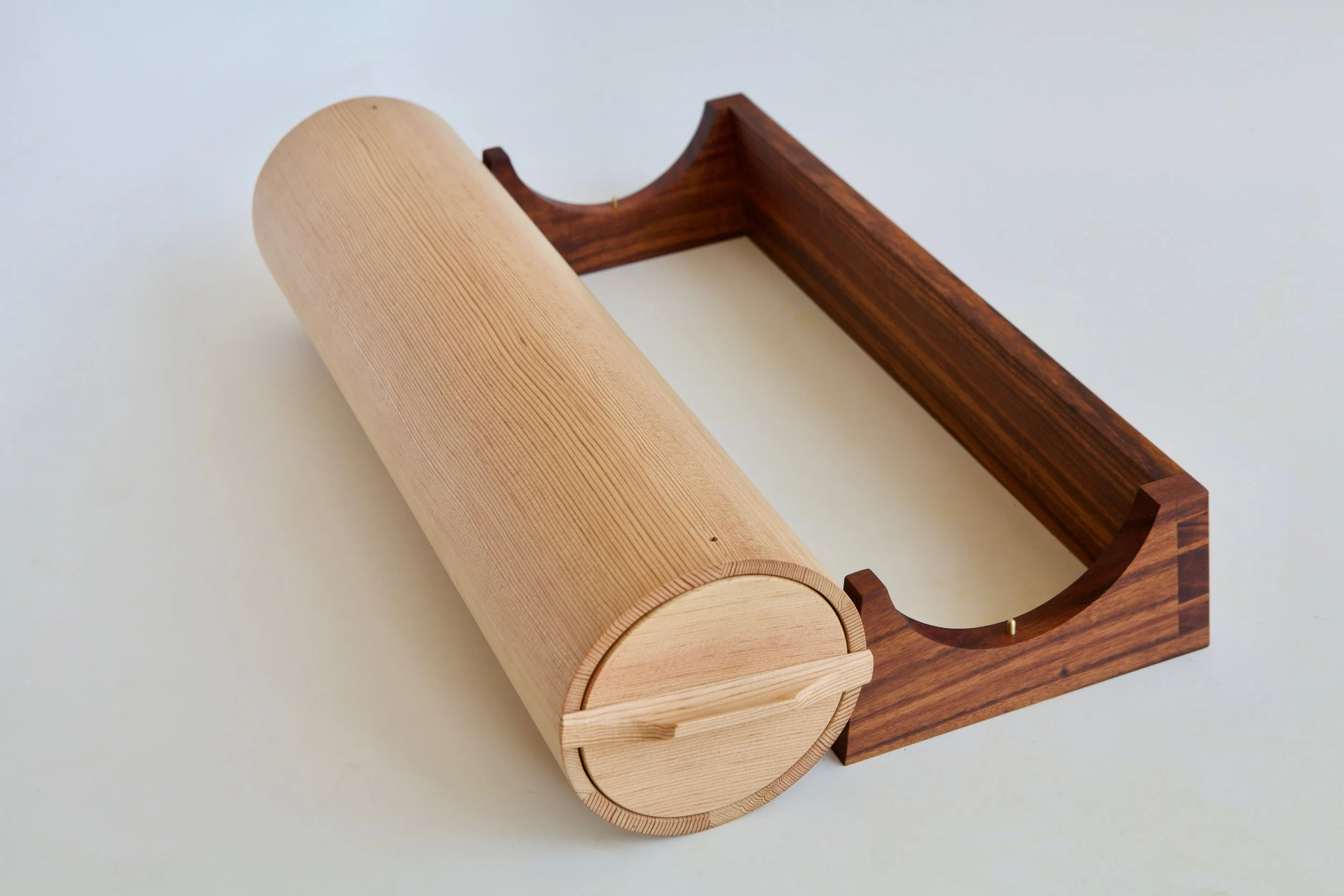  The carcase is held in place on the stand with two small tapered brass registration pins, which keeps the drawer oriented correctly, as well. 