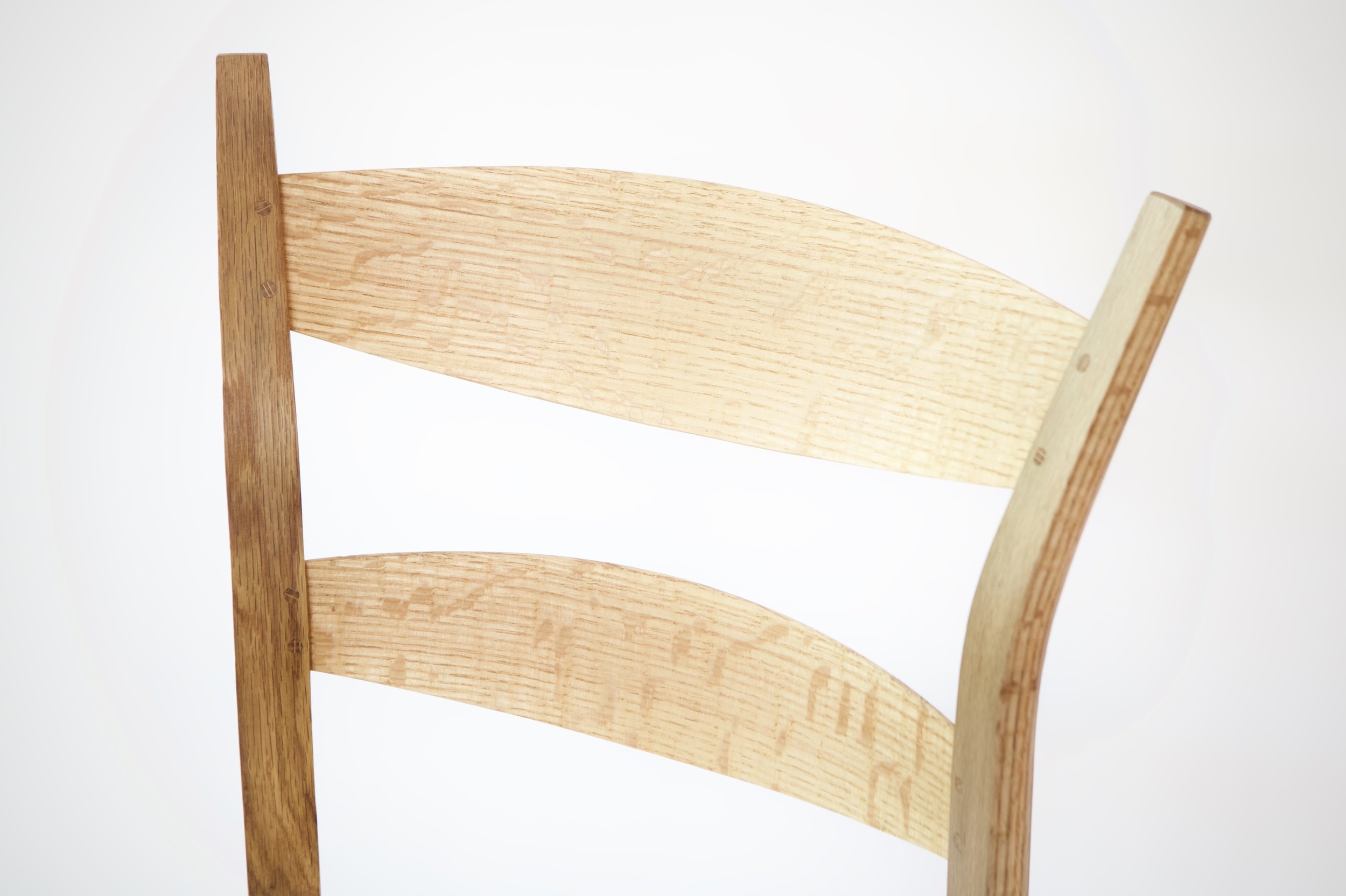 The rived slats show some beautiful ray fleck. The finish is simply a burnished coat of walnut oil, just enough to bring out the grain without hardly changing the feel of the rived wood.