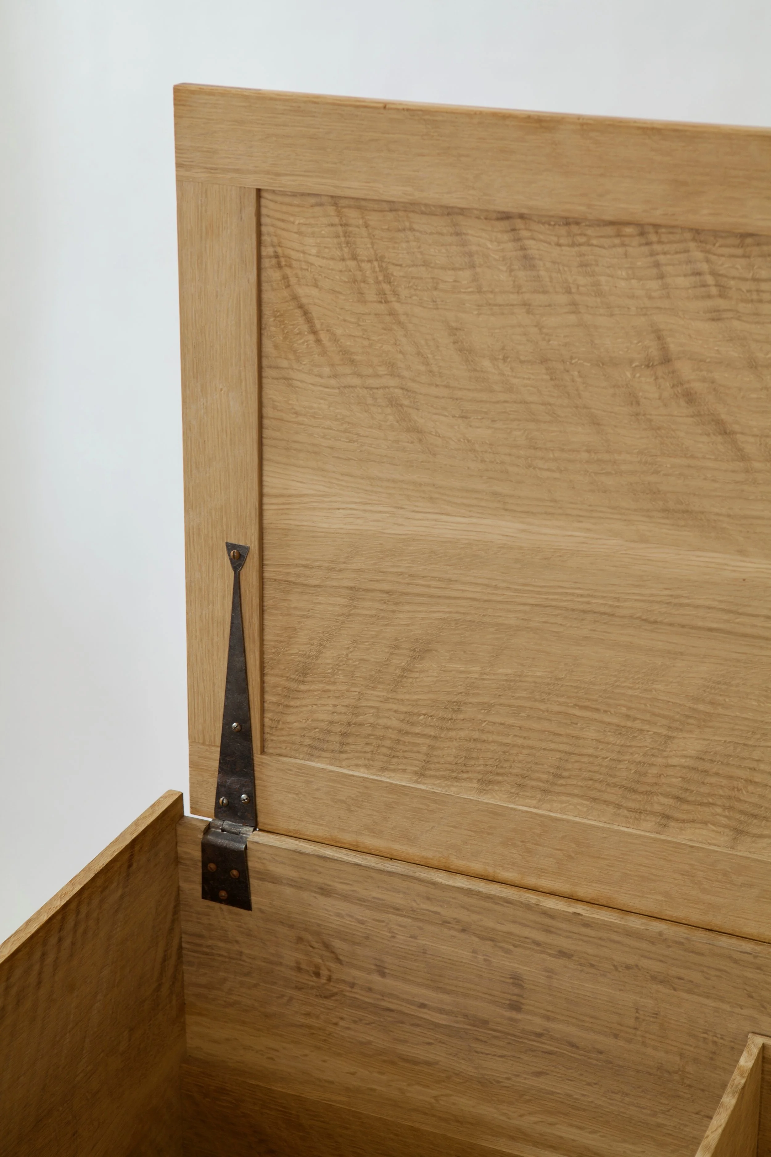  The hinges for this piece were made by Peter Ross, a North Carolina-based blacksmith. These strap hinges offset and complement the simple rectilinear structure of the chest. 