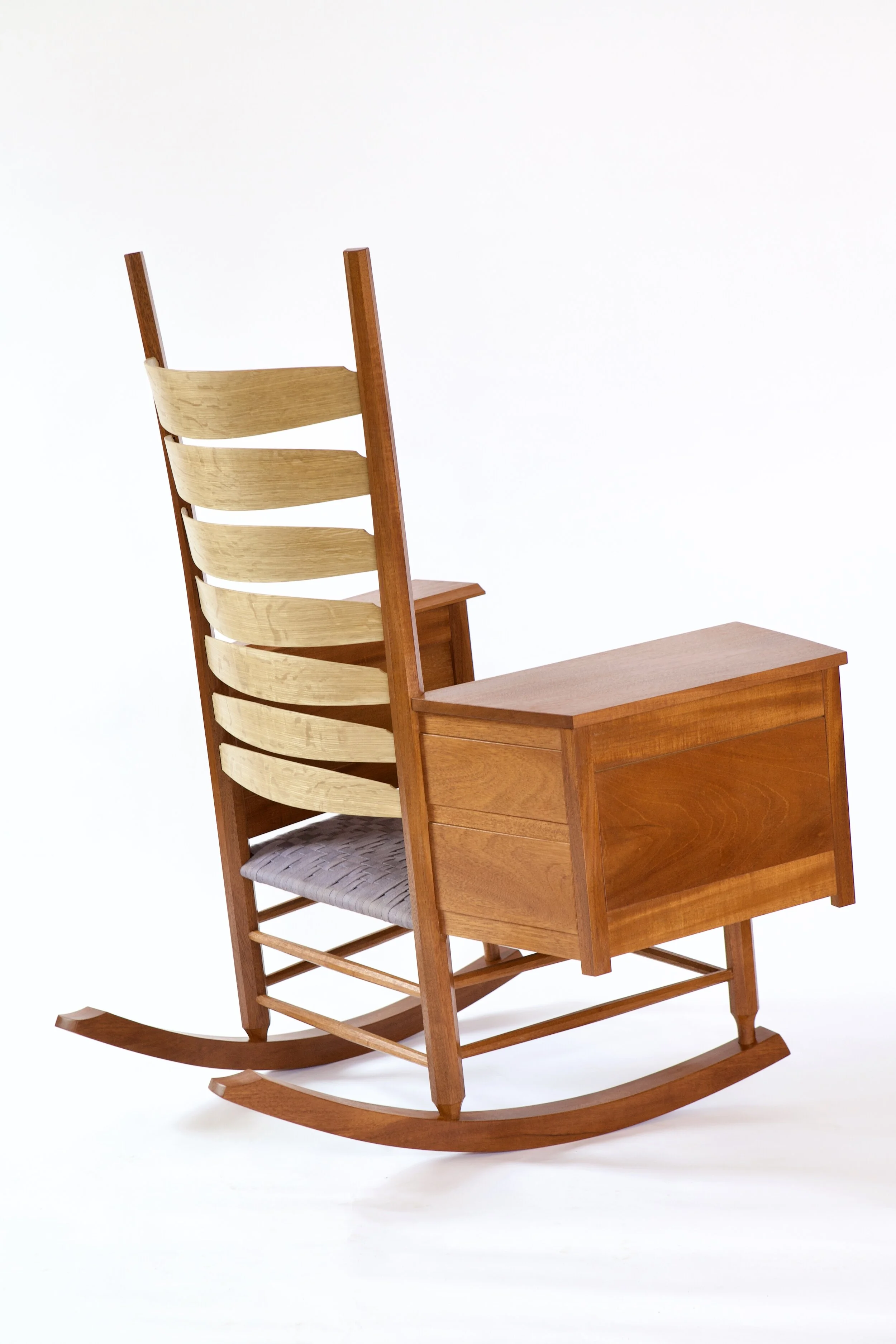  The main wood used was a single large board of Honduran mahogany. The back slats are rived white oak, and the drawer sides and bottom are white pine. The finish is french polished shellac, with a hard wax topcoat. 