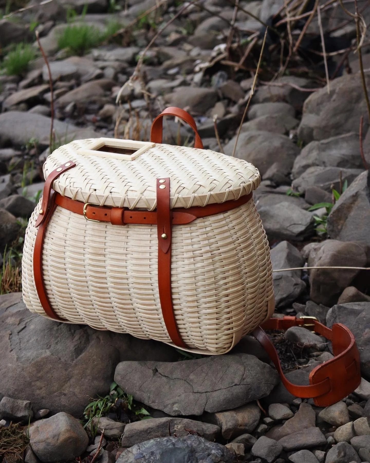 handmade fishing creel after finishing with moss lining and strap test