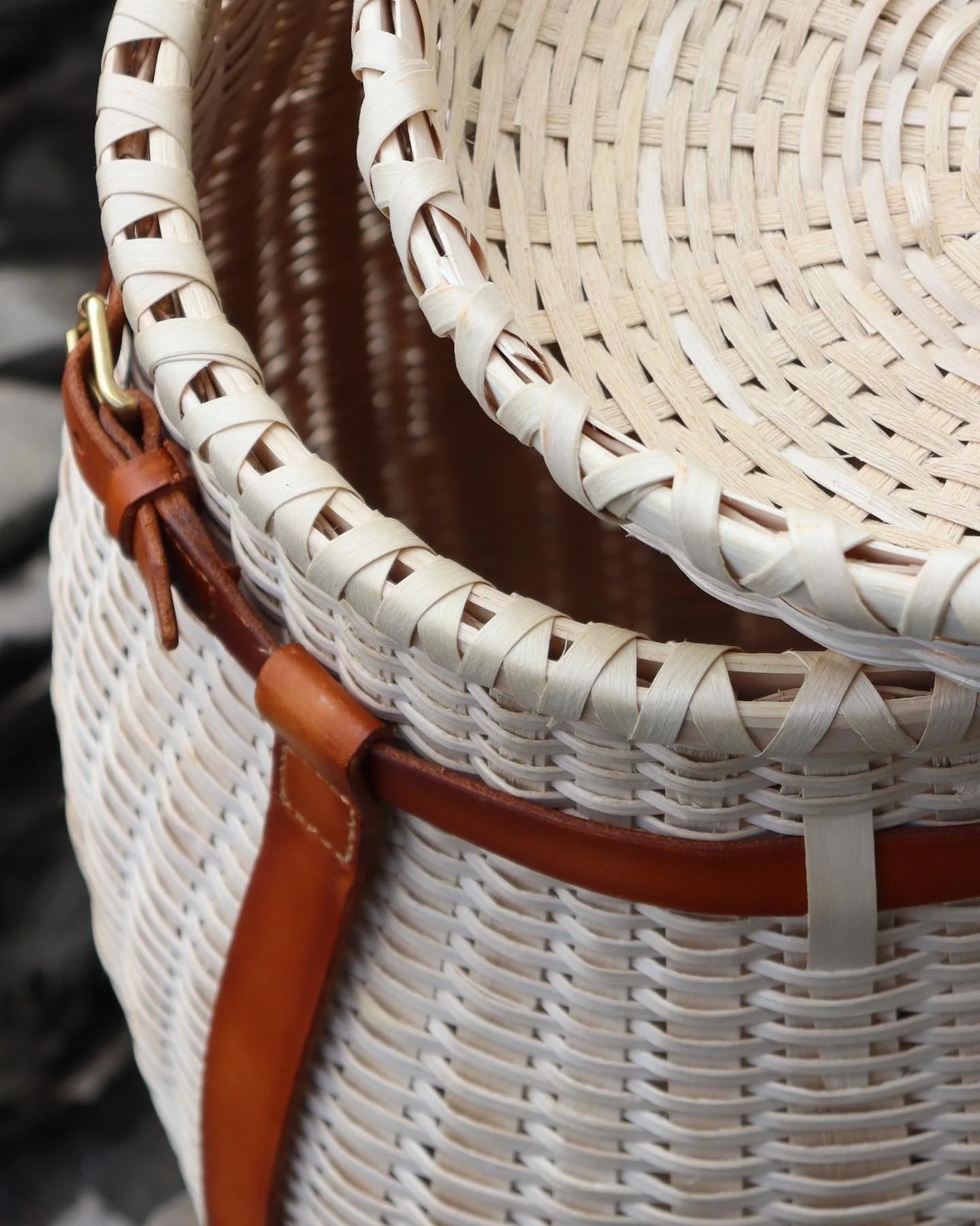  The two forms, a round-woven lid and square-woven basket, make up this piece. The narrow beveled weavers make for a strong basket and make shaping and weaving the basket a careful and consuming process. 