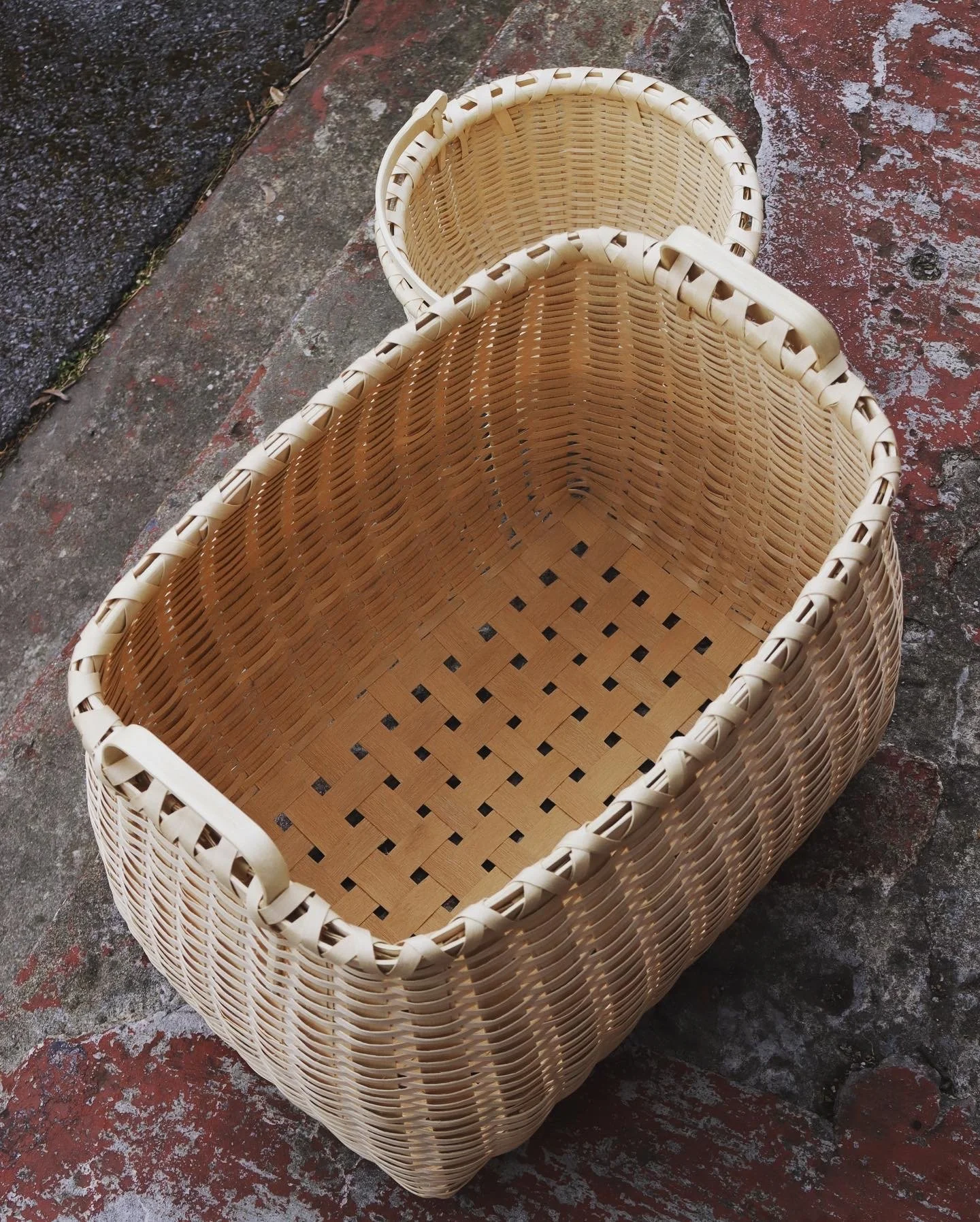  Two baskets, a large hamper and a swing-arm Taghkanic-style round basket. 