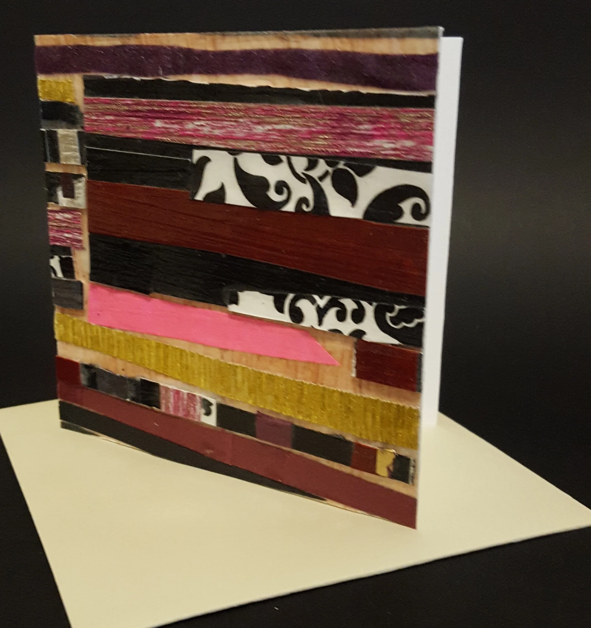  Wallpaper, patterned paper, construction paper decoupaged onto glassine that's been painted with shoe polish 