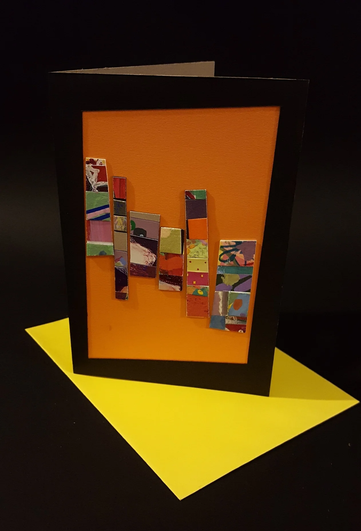  Various papers, black posterboard frame 