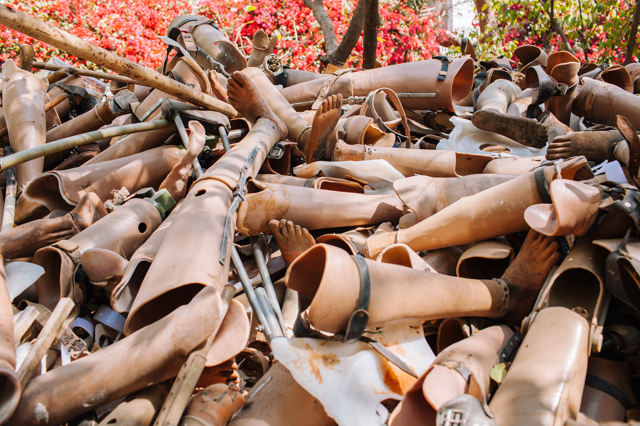  Discarded prosthetic limbs fill the courtyard of Bhagwan Mahaveer Viklang Sahayata Samiti (BMVSS), also known as Jaipur Foot. BMVSS is an organization based in Jaipur, India, specializing in low-cost artificial limbs. 