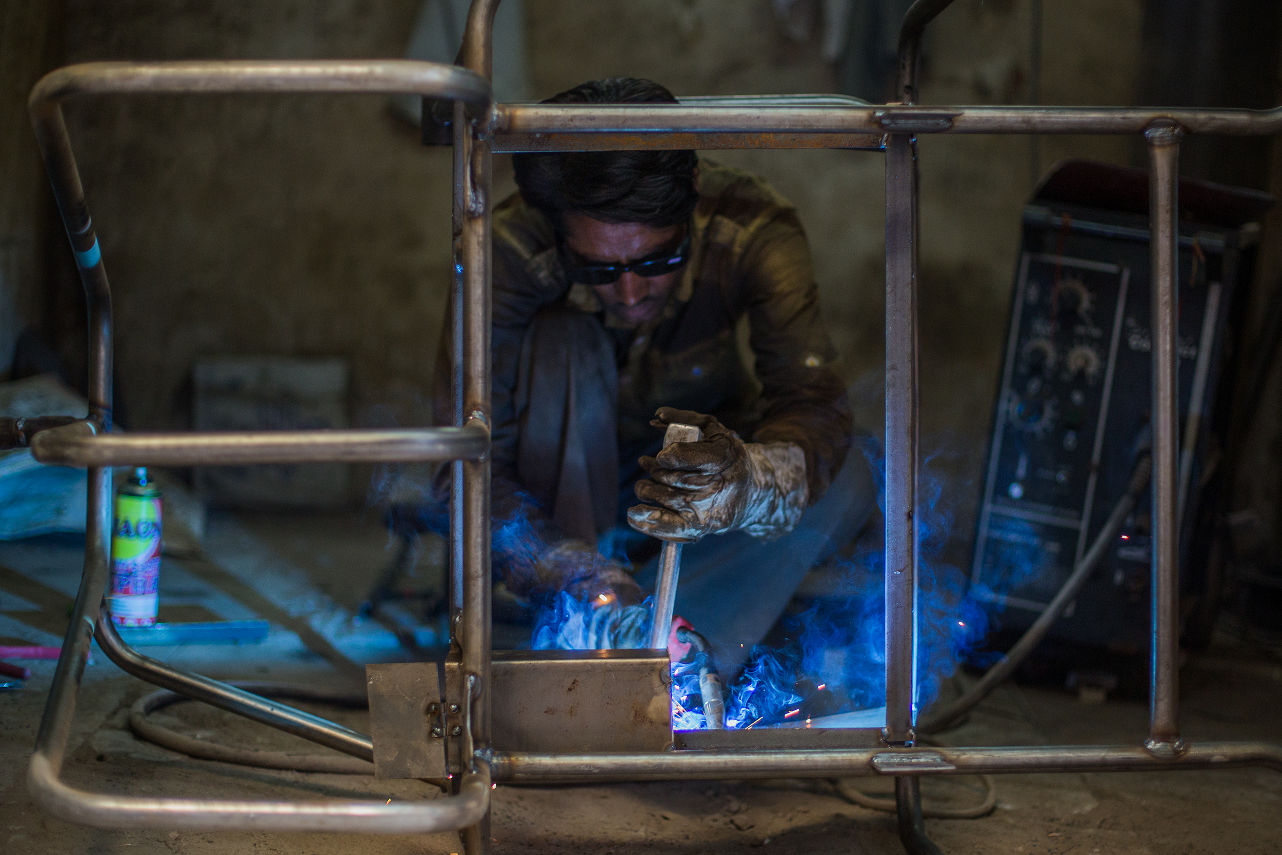  Welding a hand-pedaled tricycle frame for patients who have lost both their feet or mobility of their lower limbs. The tricycles are provided free of charge and enable patients to independently move around and increase their autonomy. 