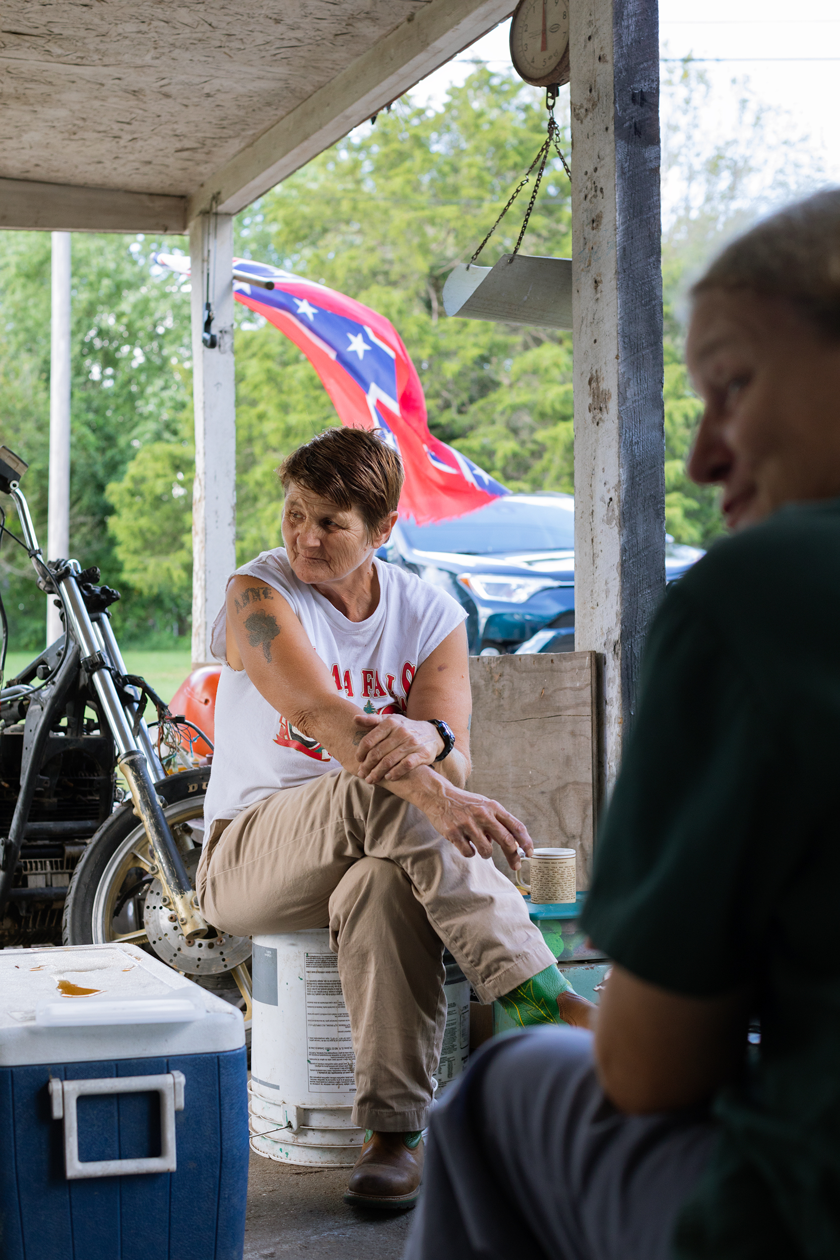 Brenda and Theresa on their front porch in Mountain Grove, Missouri, where a household of six starts and ends most of their days.