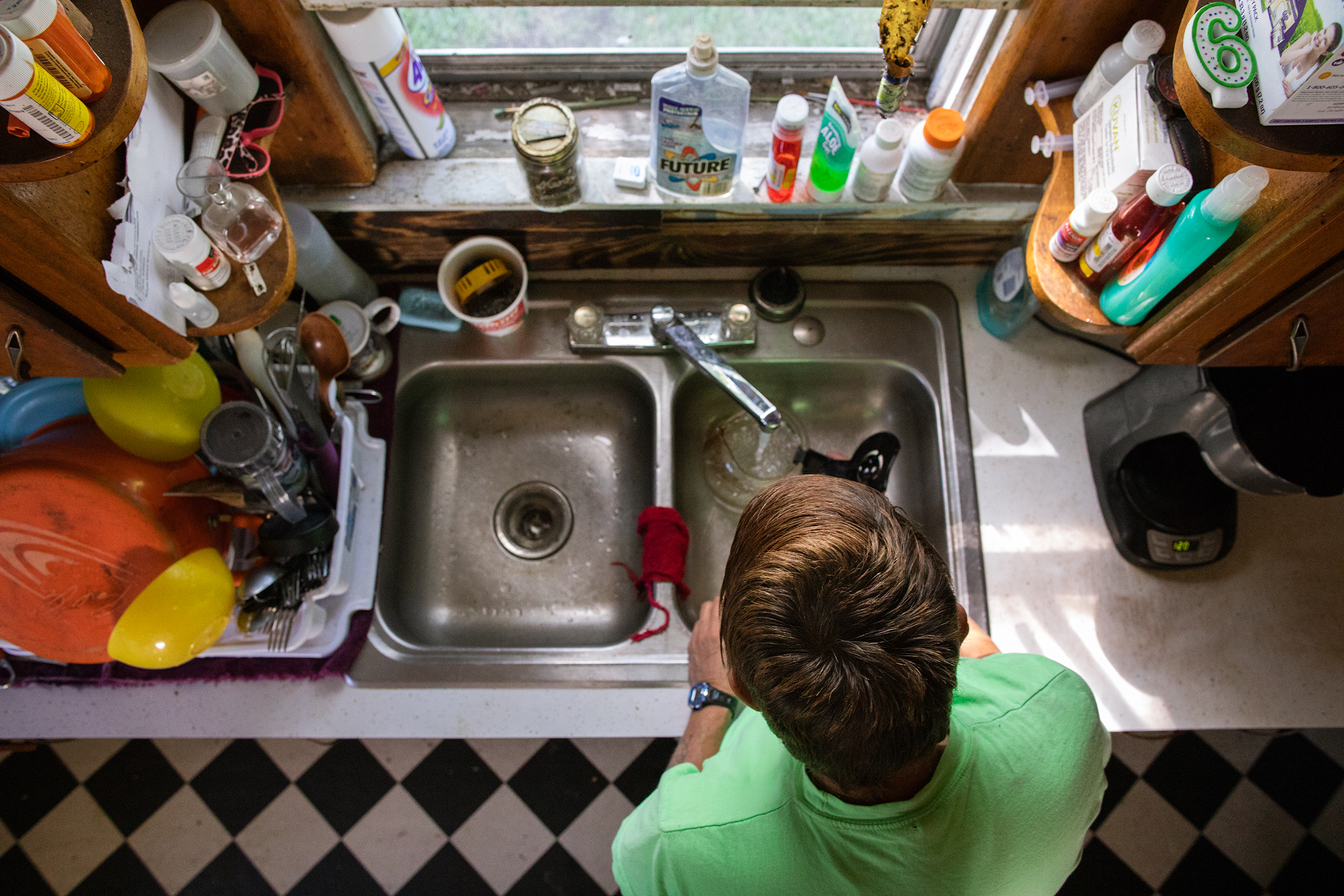 After everyone leaves for the day, Brenda cleans the kitchen and organizes things around their Mountain Grove home.