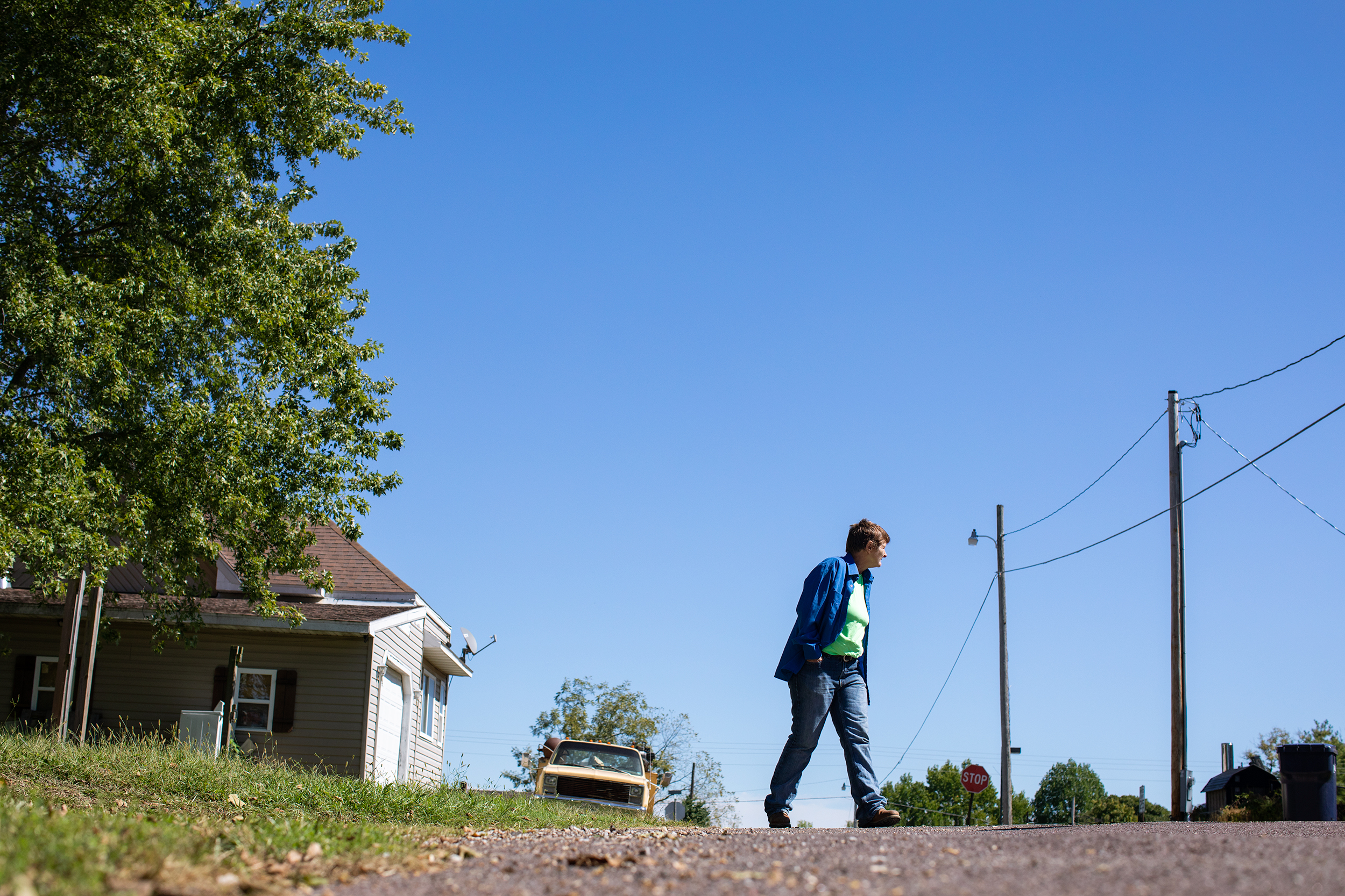  Brenda walks around her neighborhood in Mountain Grove, Mo. Although her difficult past and financial challenges keep her on the edge, she’s determined to keep on going, looking for ways to survive. 