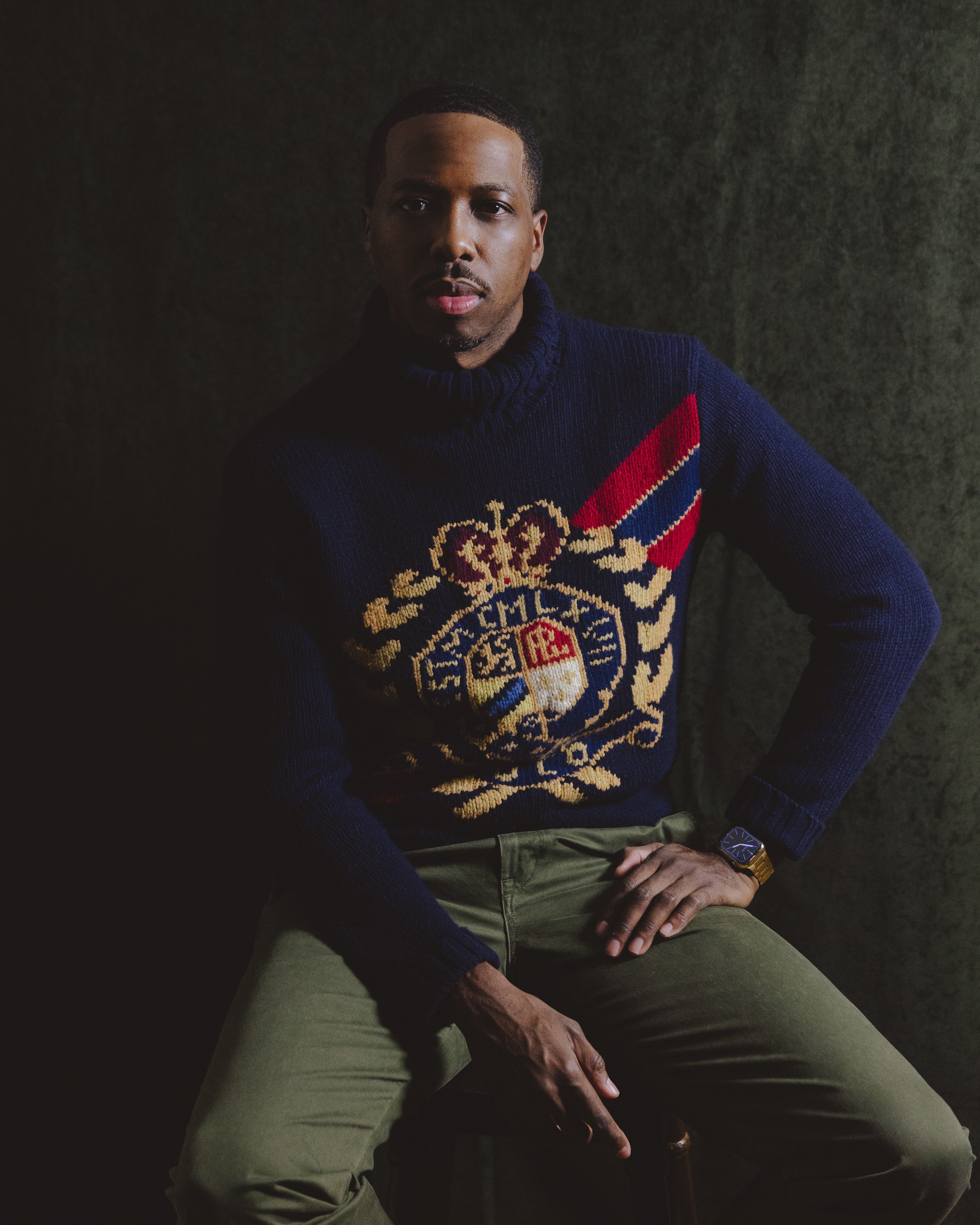 Jackson Reese seated in a navy sweater