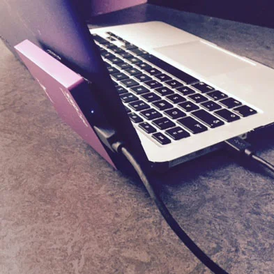 I've added some Velcro to the back of my MacBook's protective cover and to the back of the SSD2go. This way I can use and move my laptop around without worrying about the drive falling.