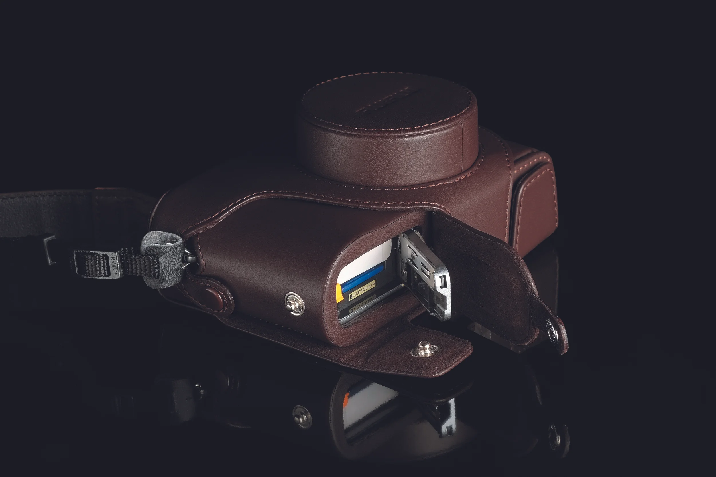 I still use the old X100 case but the latest edition has a latch that lets you access the battery and SD-card compartment. Image © Fujifilm