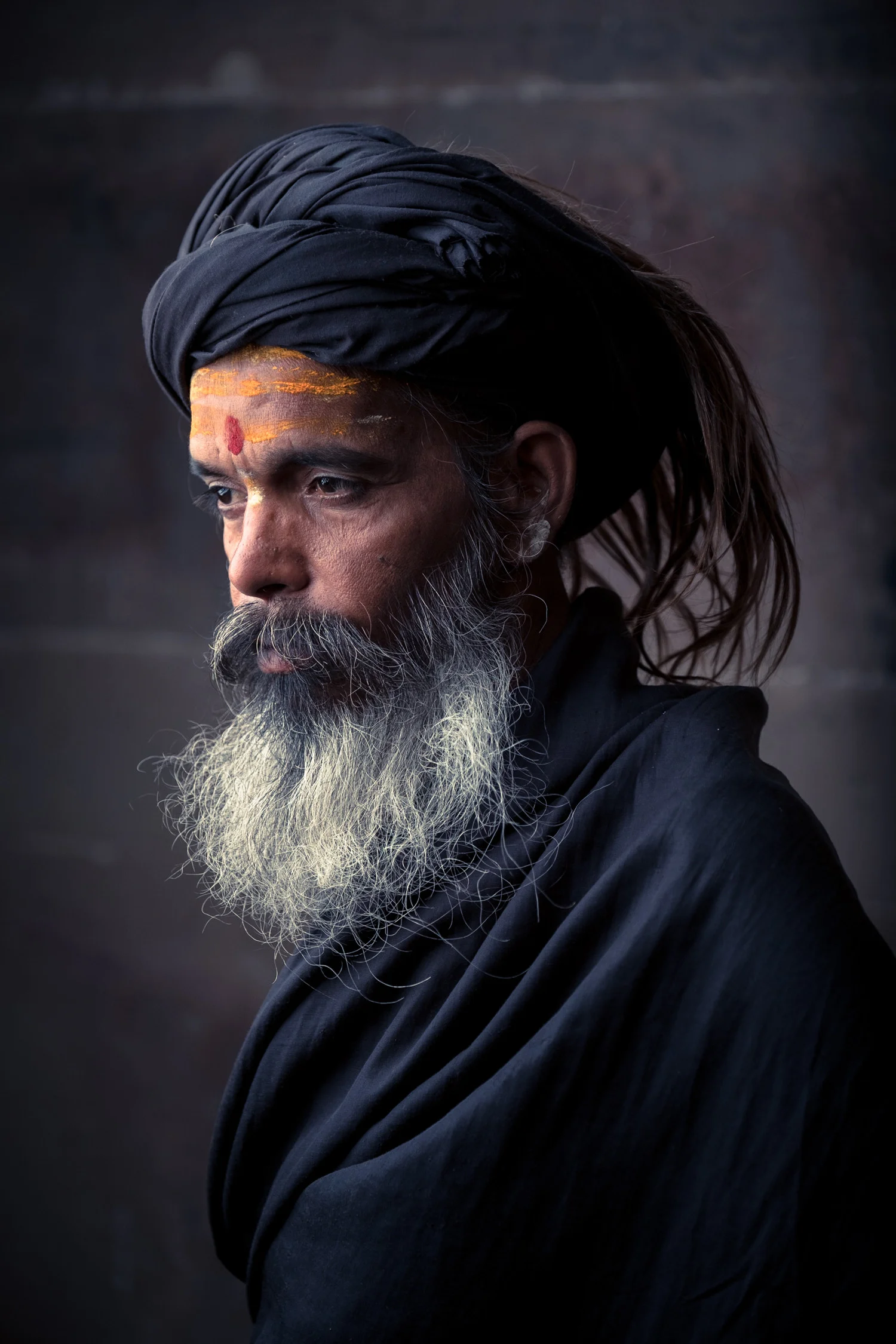 We used a so-called 'Short Lighting' light setup here because it works great with character faces like this sadhu's.