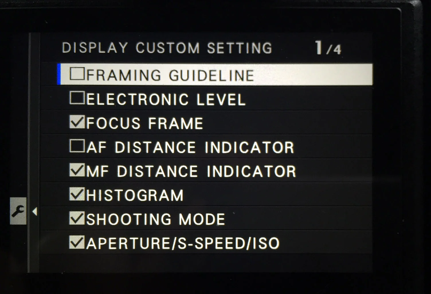 In the camera's settings, you can choose what info you want to be displayed on the EVF. You can do this separately for capture and playback. During playback, you can press the DISP/BACK button to cycle through a couple of other screens, including one without any overlays that lets you focus on the actual picture.