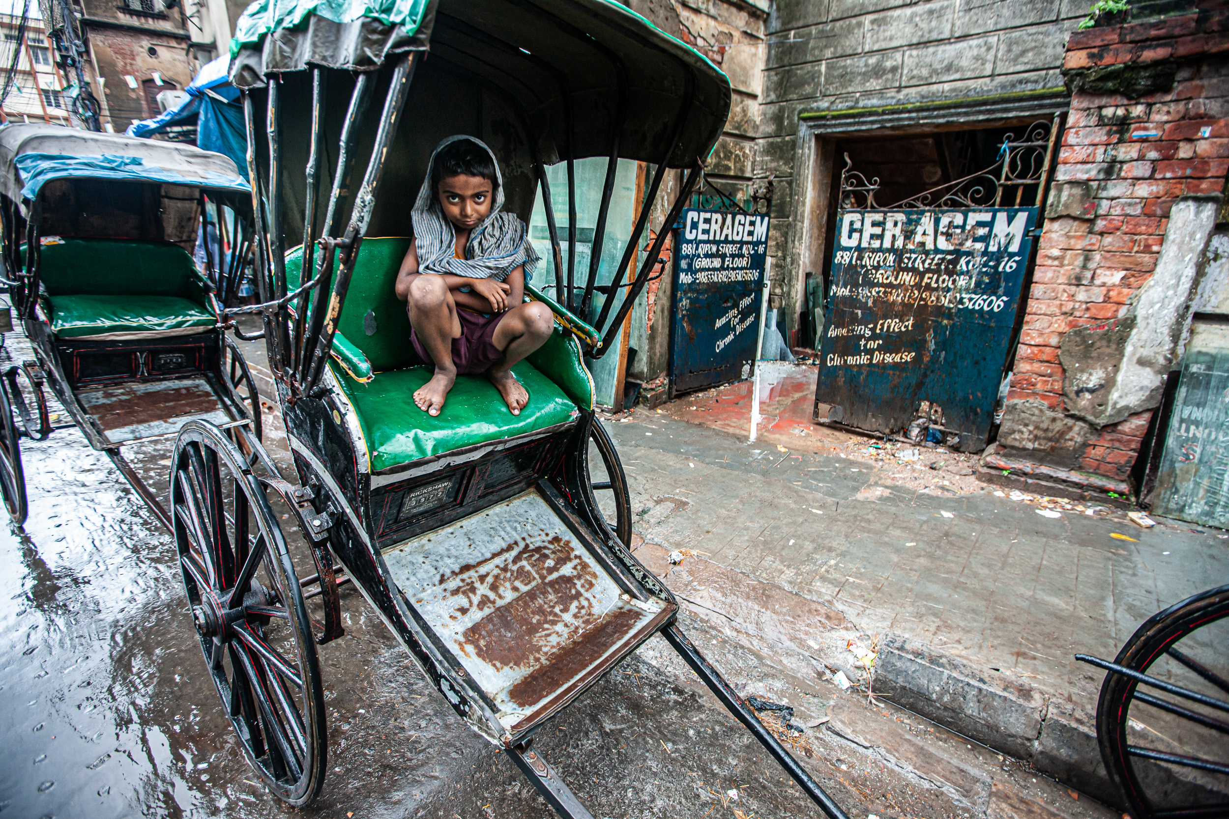  When not in use a rickshaw makes a handy restingplace. 