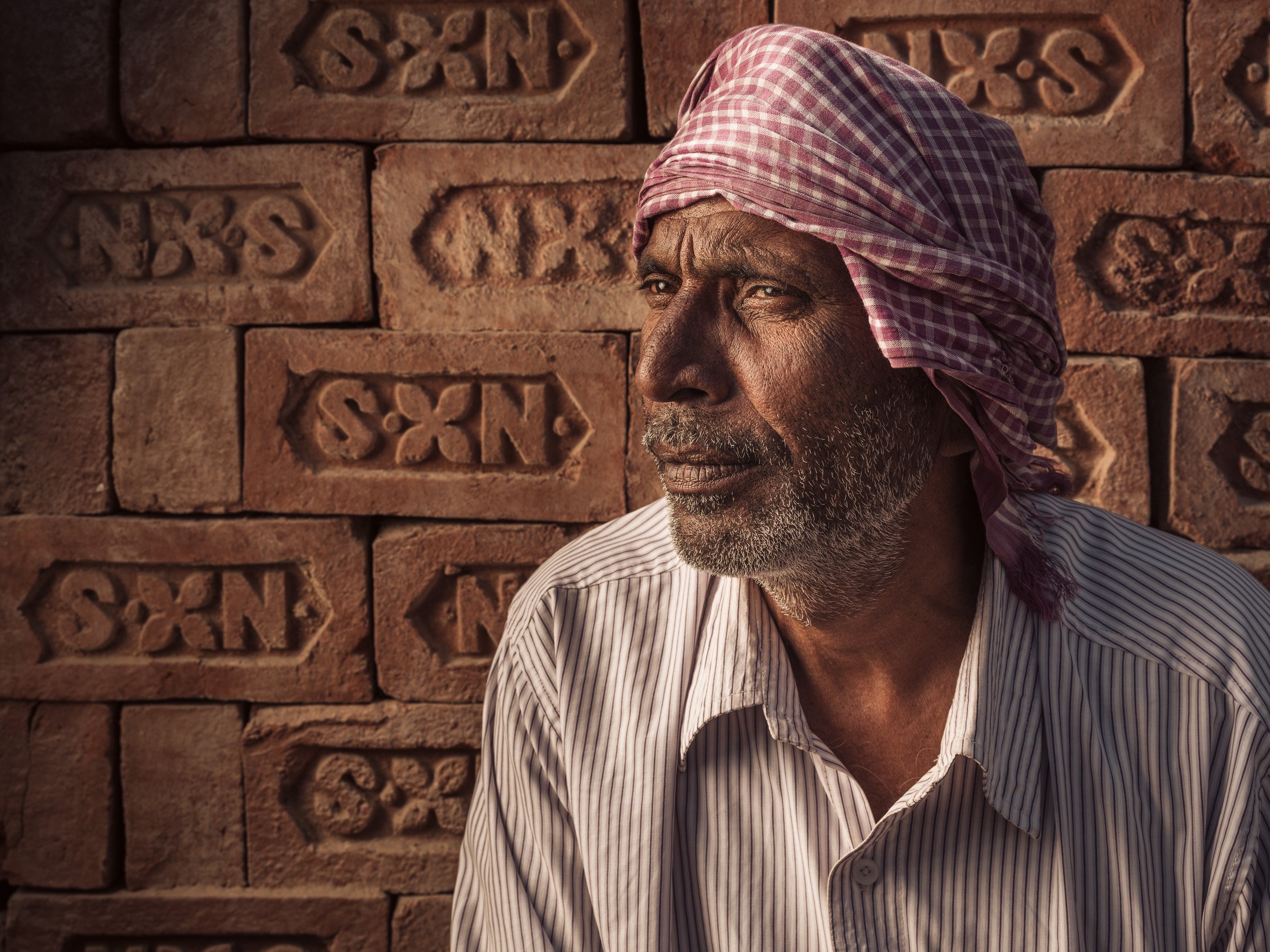 Portrait of a worker in a brick factory, Varanasi