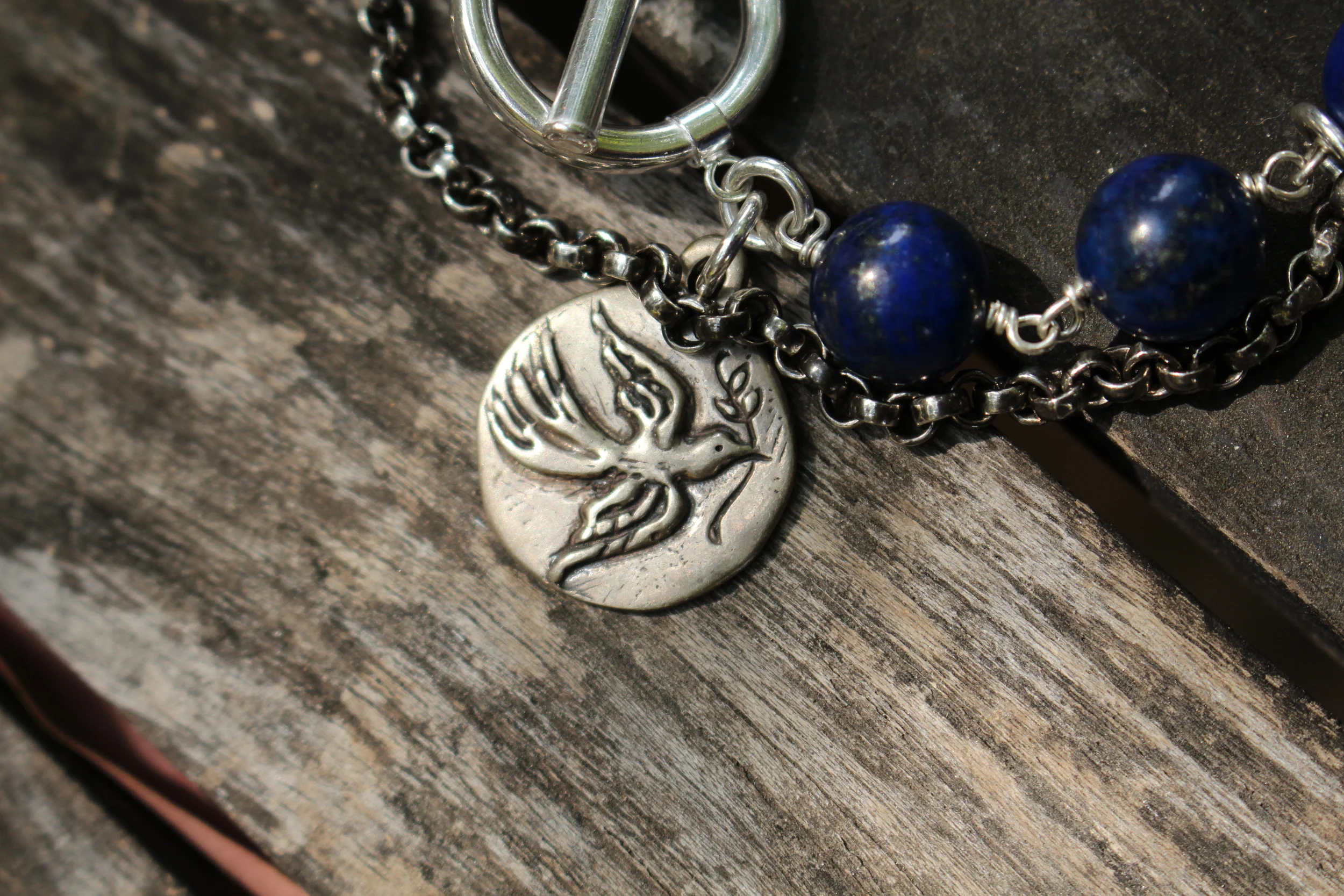 Lapis and Tiger Eye Skull Bracelet Dove Coin Close Up