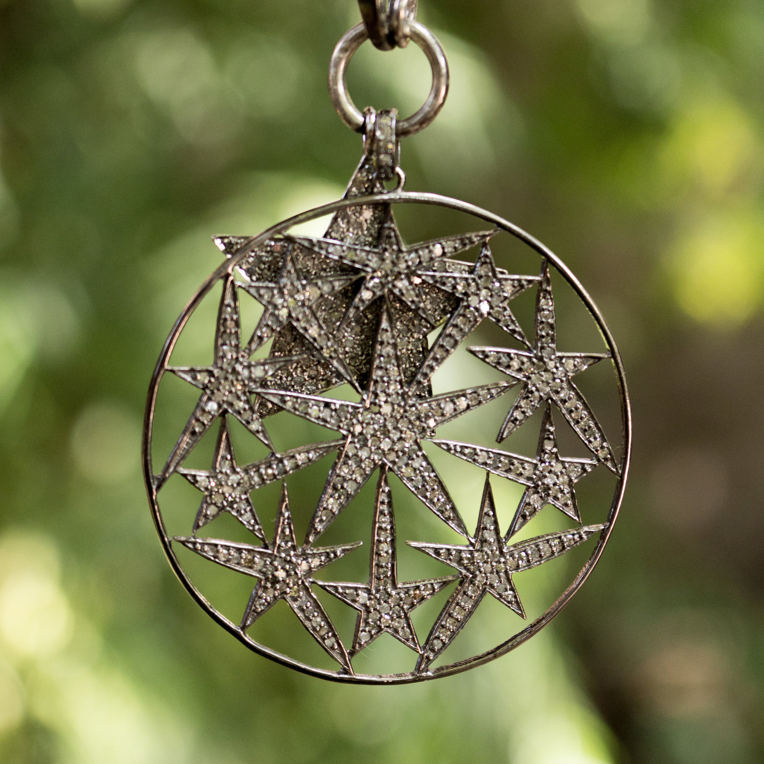 Circle and Stars Diamond Pendant Close Up Hanging