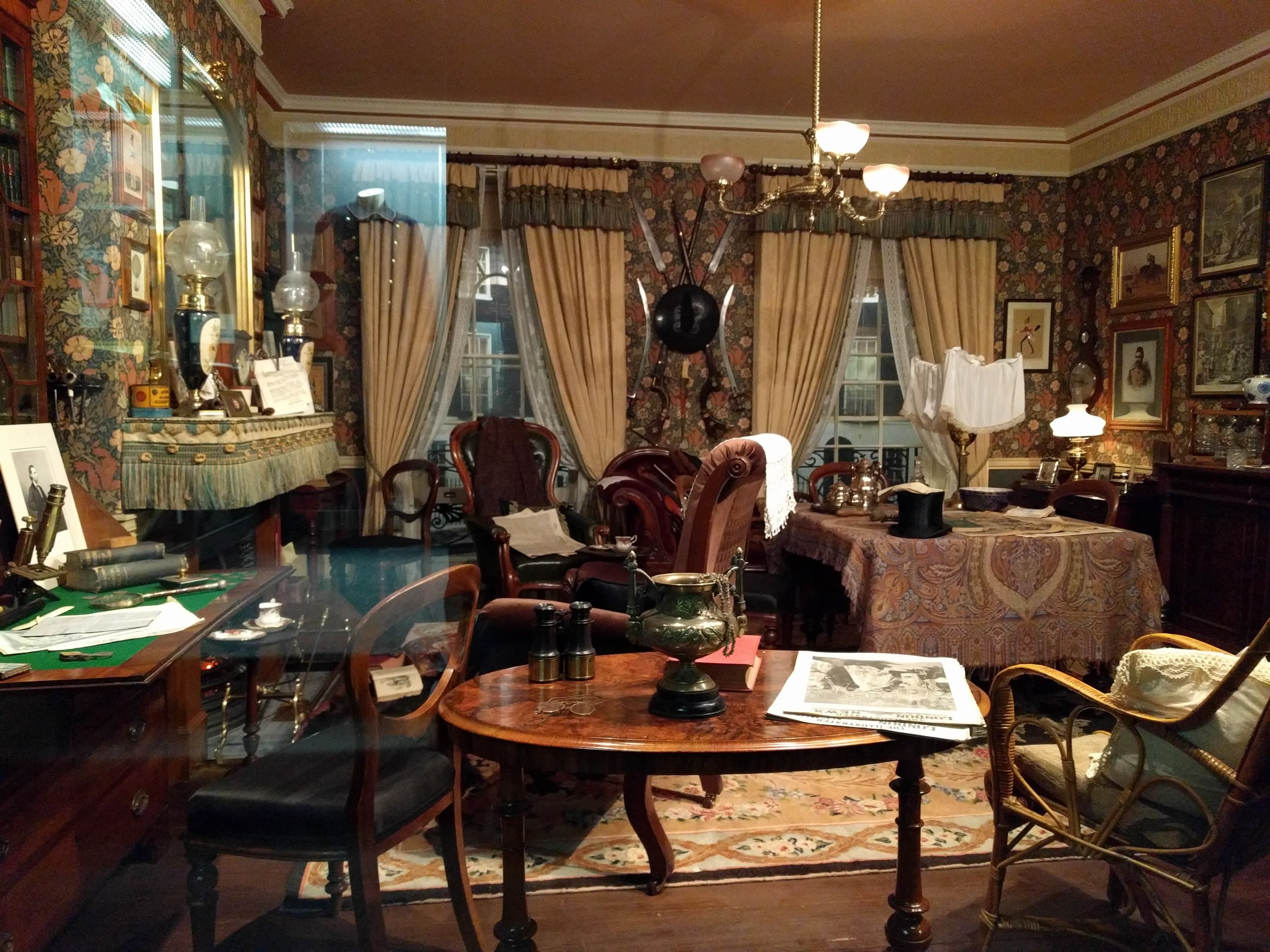 The audio guide says this is the only authentic re-creation of the living room at 221b Baker Street, because the designer used the books and illustrations to get accurate dimensions, designs, and furniture pieces where possible. And all the furniture is actual period pieces. This desk with the green top at the left is Watson's writing desk (Holmes's is in the opposite corner). Over the fireplace, you can see where Holmes has stuck his mail into the mantle with a knife; and on the wall between the windows are two jezail rifles, like the kind Watson got shot by in the Afghanistan war. You can't walk into the room, you have to sit outside a floor-to-ceiling window, but it was still cool. And there was a nice bench for my tired old Reichenbach-hiking legs. 