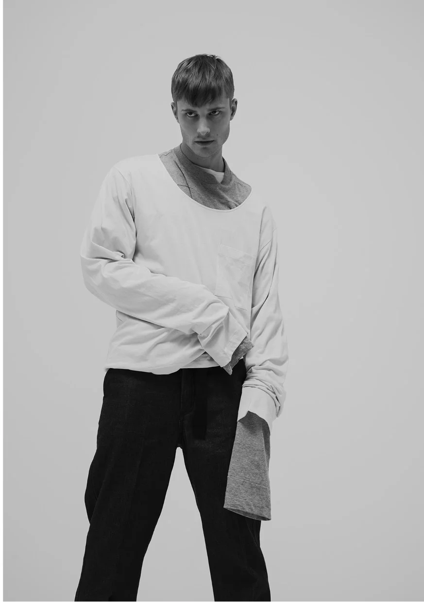 Superposition of 2 oversized cotton shirts by Prada & fisherman denim pants by Loewe