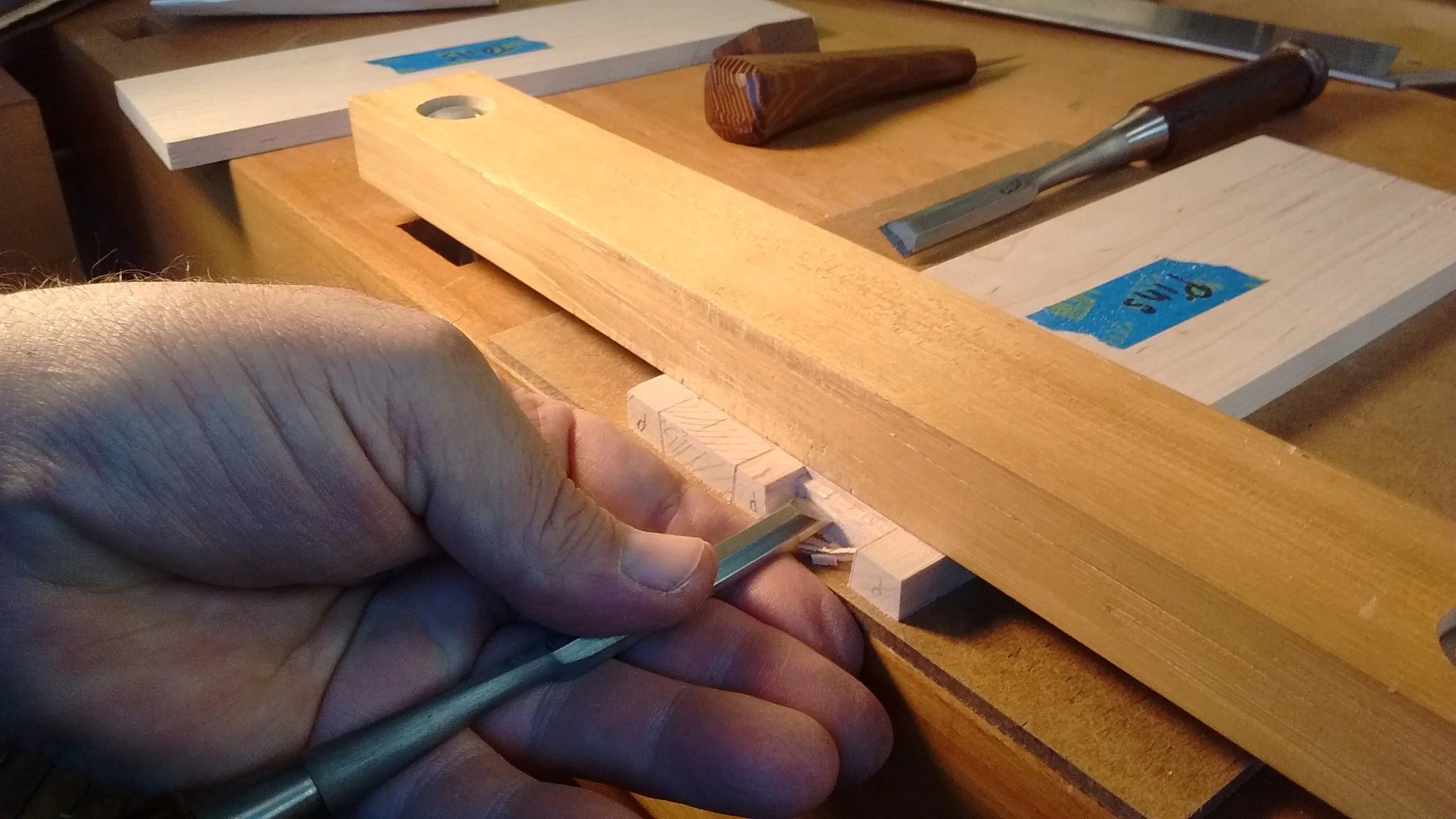 Removing the waste between dovetail pins