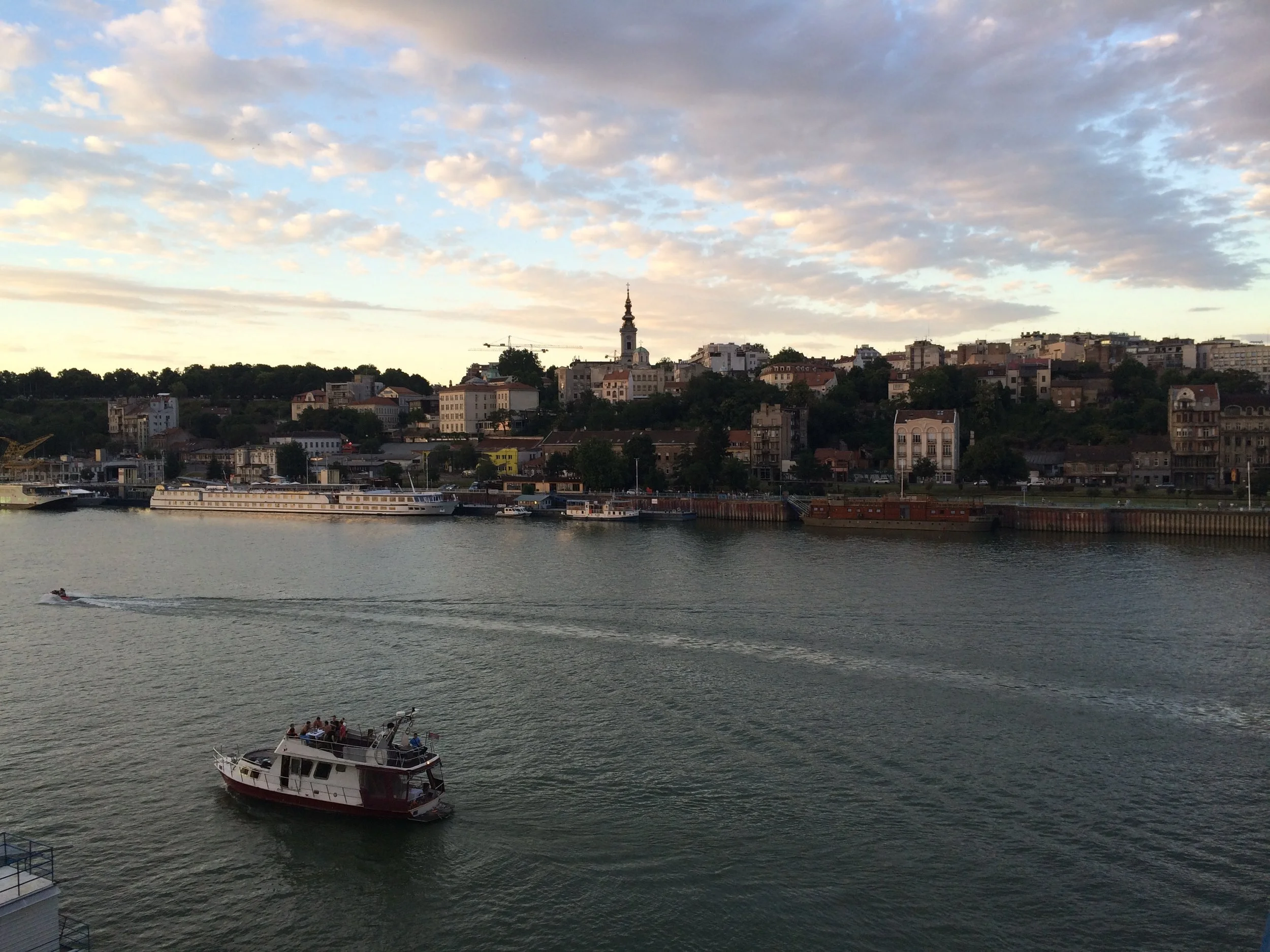 River Sava at sunset. The boats and barges contain bars and restaurants.