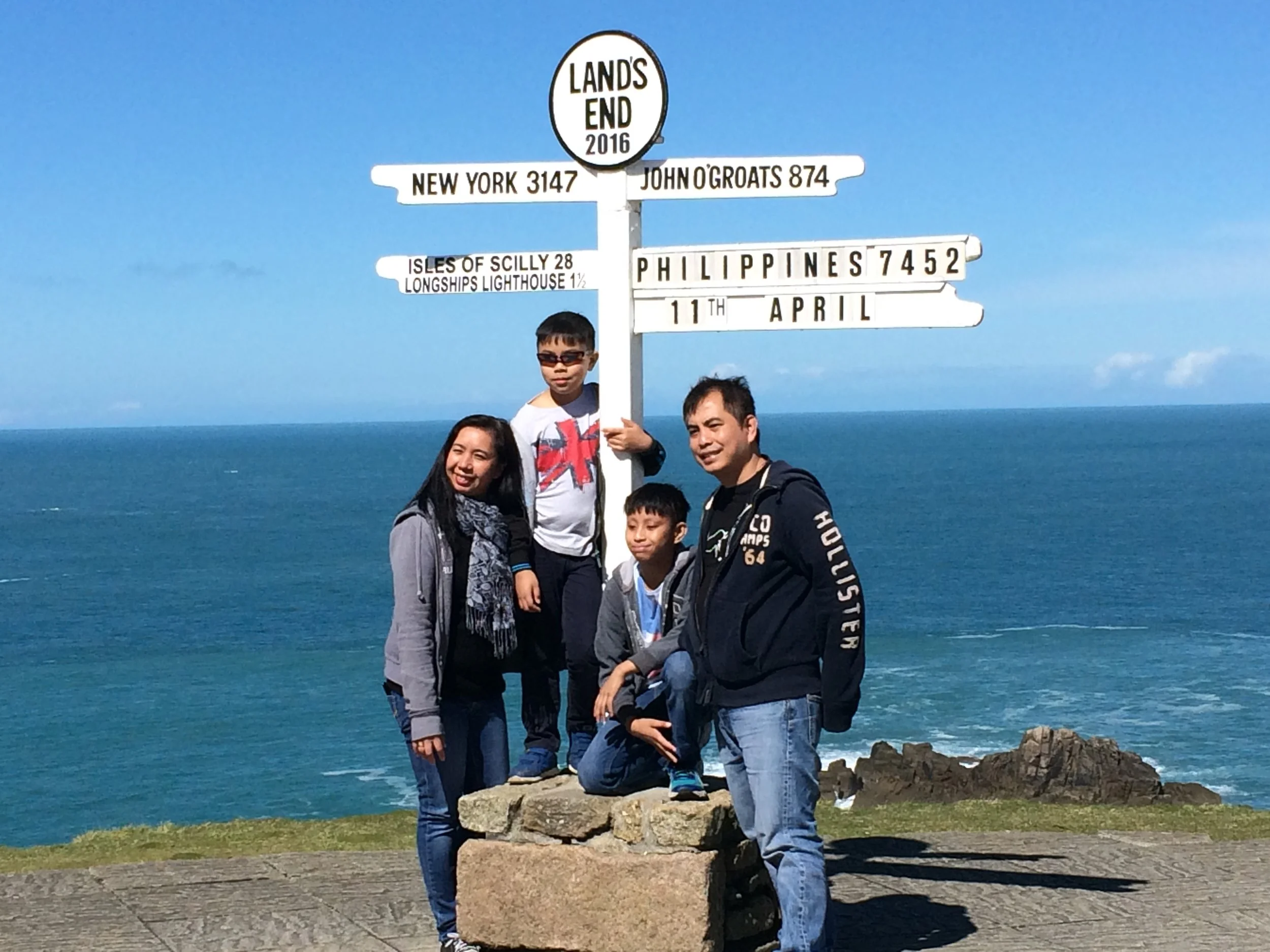 The most famous landmark at Land's End is the signpost, but since they charge 9 pounds just to pose (plus the cost of the photo), I took a shot of this Filipino family instead.