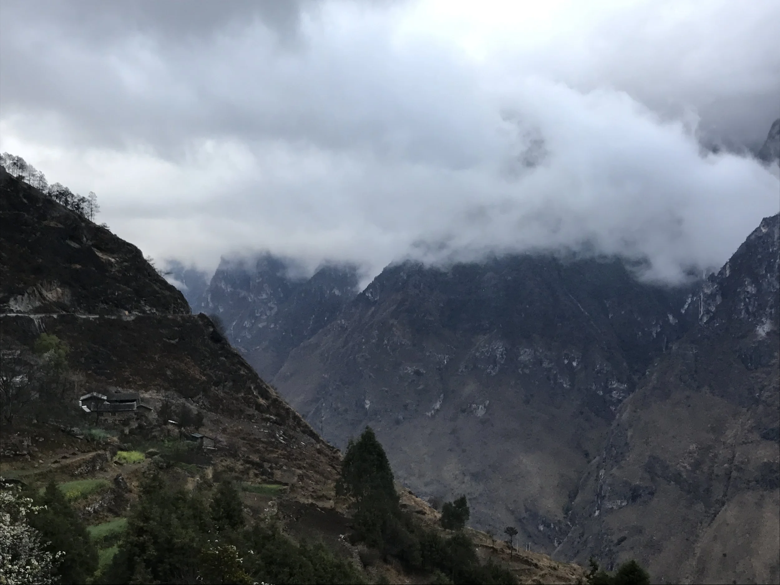 The trail continues around the mountain on the left