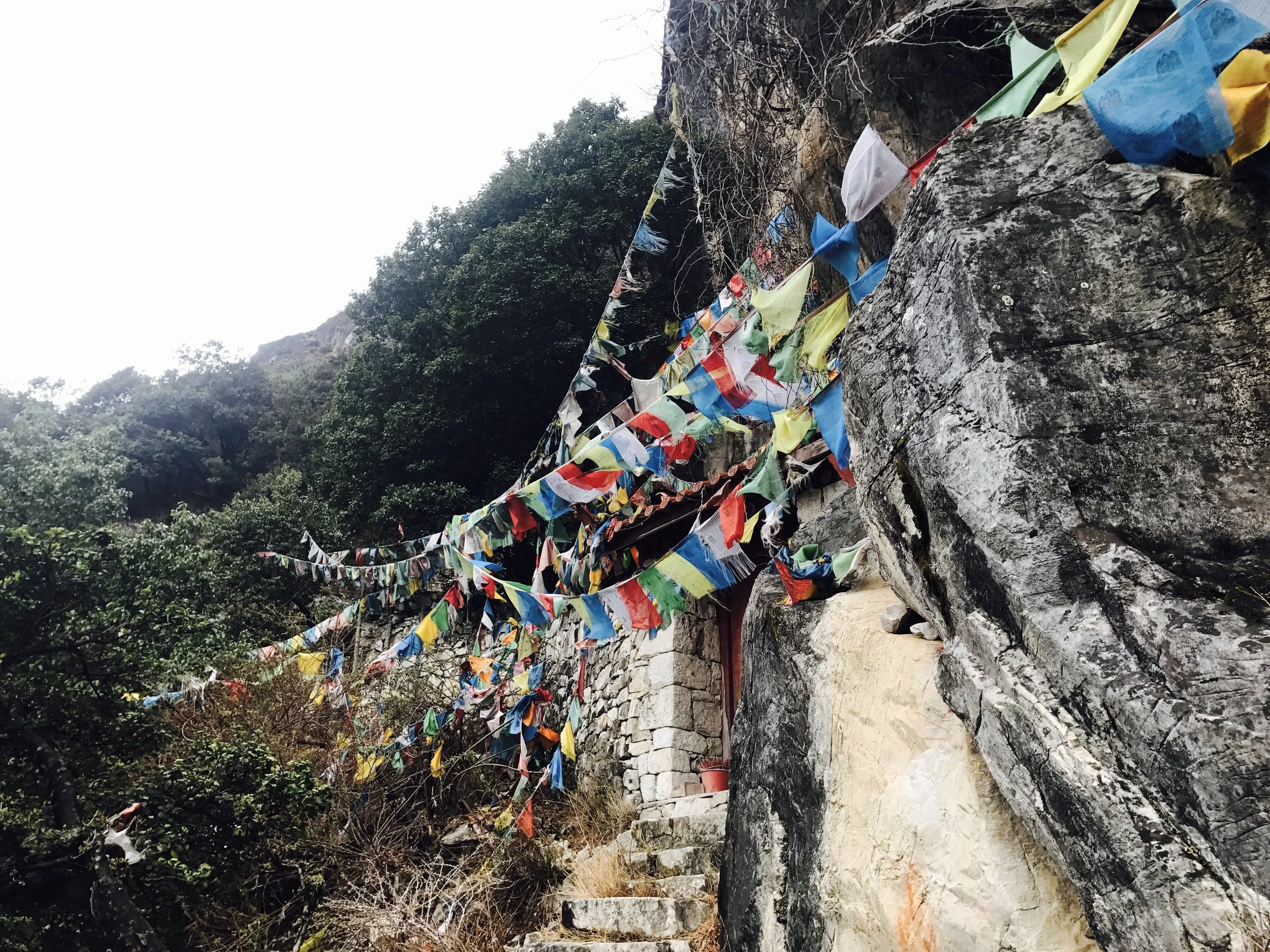 Buddhist prayer flags on the trail. The five colors are arranged in specific order and represent the five elements.