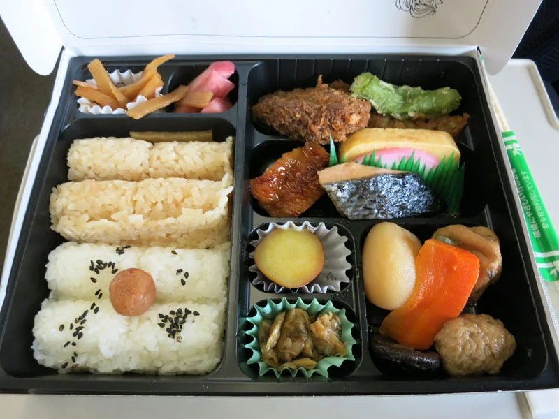 Besides rice and the piece of fish, I challenge you to name the other components of this Bento