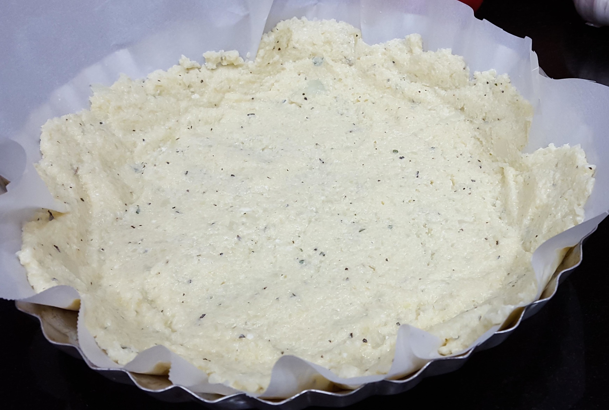  This is what your cauliflower crust will look like before you bake it. Note that the crust is pre-baked before the other ingredients are added which adds to its crunch.