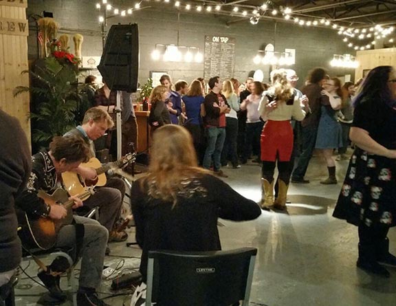 Square dancing at the Peabody Heights Brewing Company in Baltimore