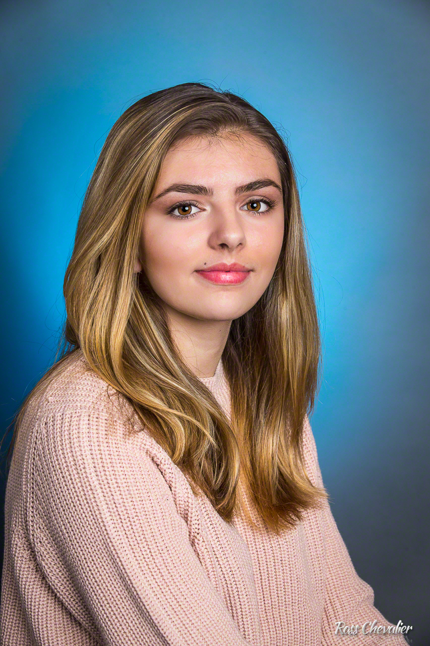 A simple portrait with a single main light and a background light, This is a great use of the 85mm.