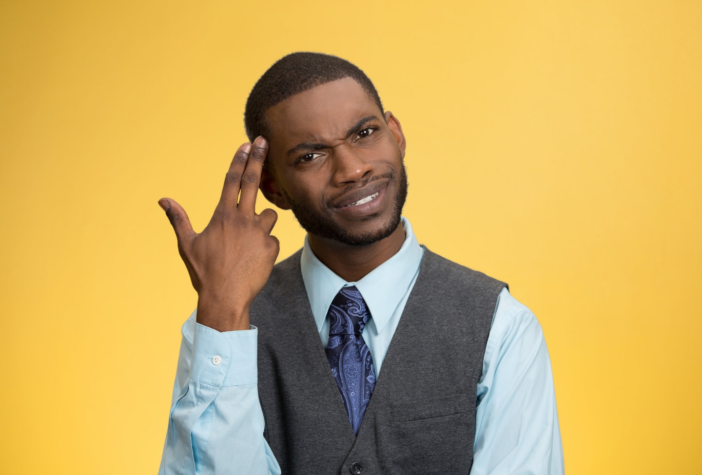 Man asking are you crazy, idiot? isolated on yellow background